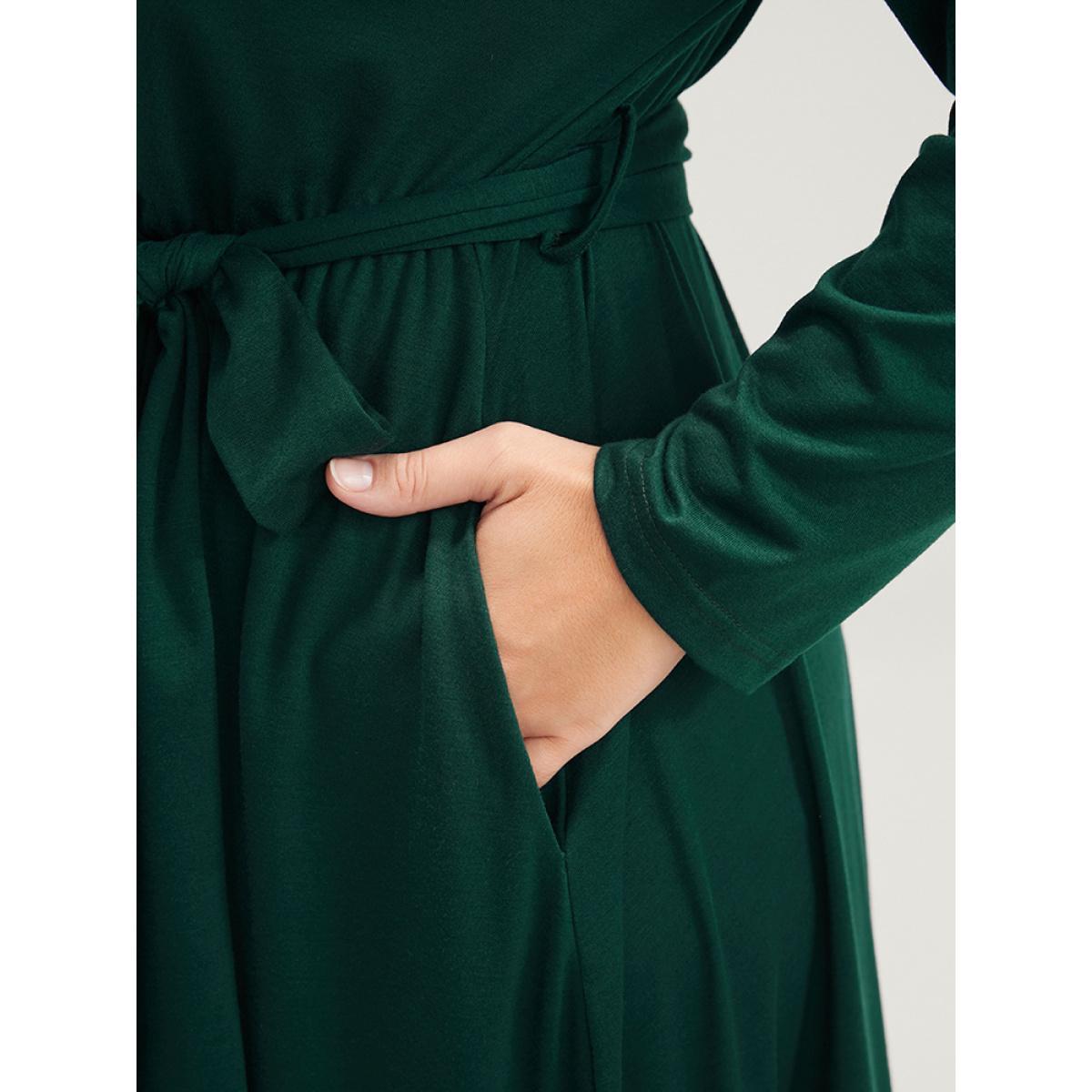 Plus Size Solid Wrap Pocket Belted Asymmetrical Hem Dress DarkGreen Women Elegant Cross straps V-neck Long Sleeve Curvy Midi Dress BloomChic 28/5X Product Image