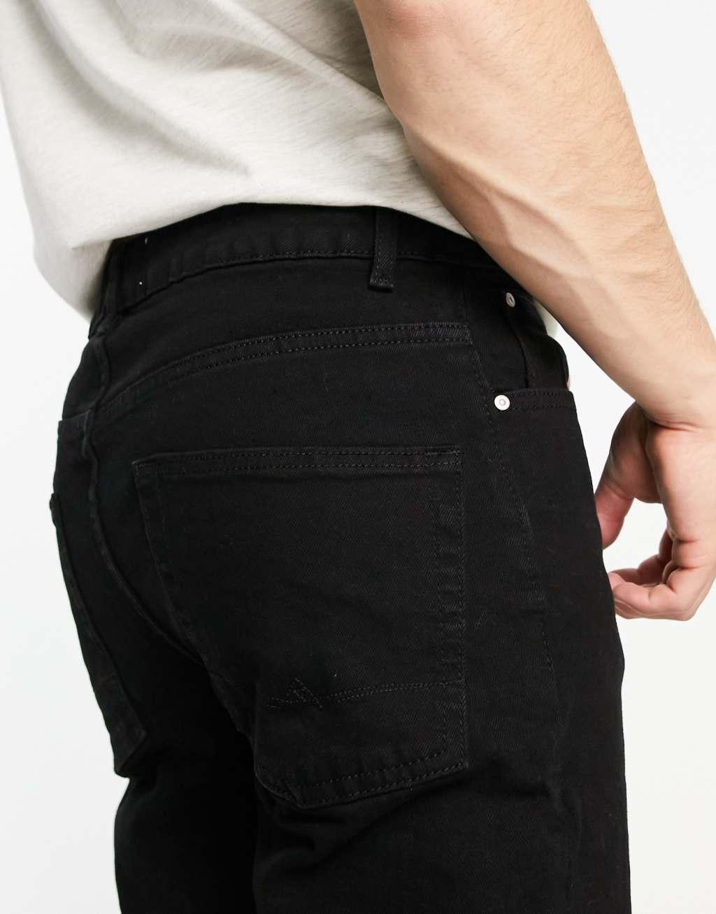 ASOS DESIGN tapered jeans in black Product Image