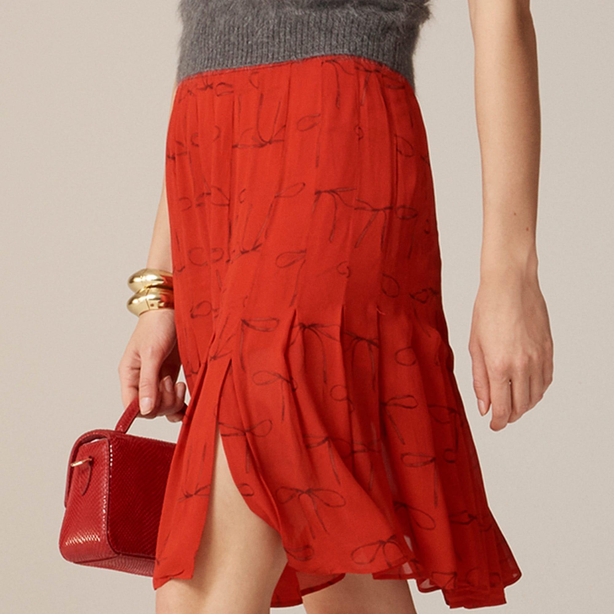 Pleated knee-length skirt in bow-print viscose chiffon Product Image