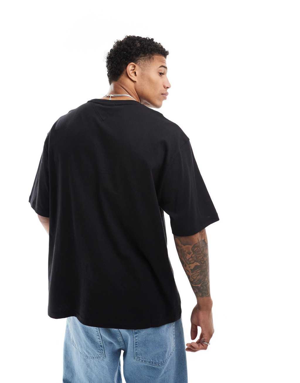 Tommy Jeans oversized crest varsity sports T-shirt in black Product Image