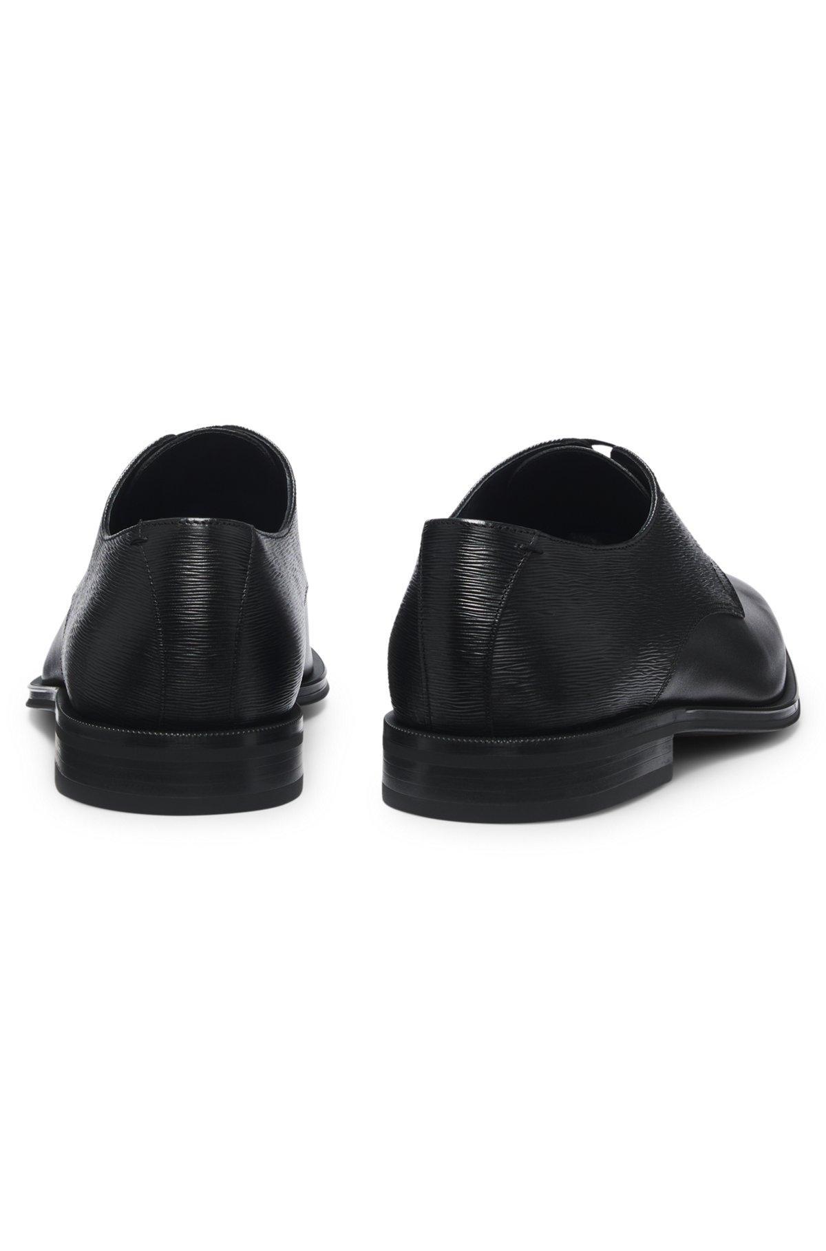Plain and structured Derby shoes in leather Product Image