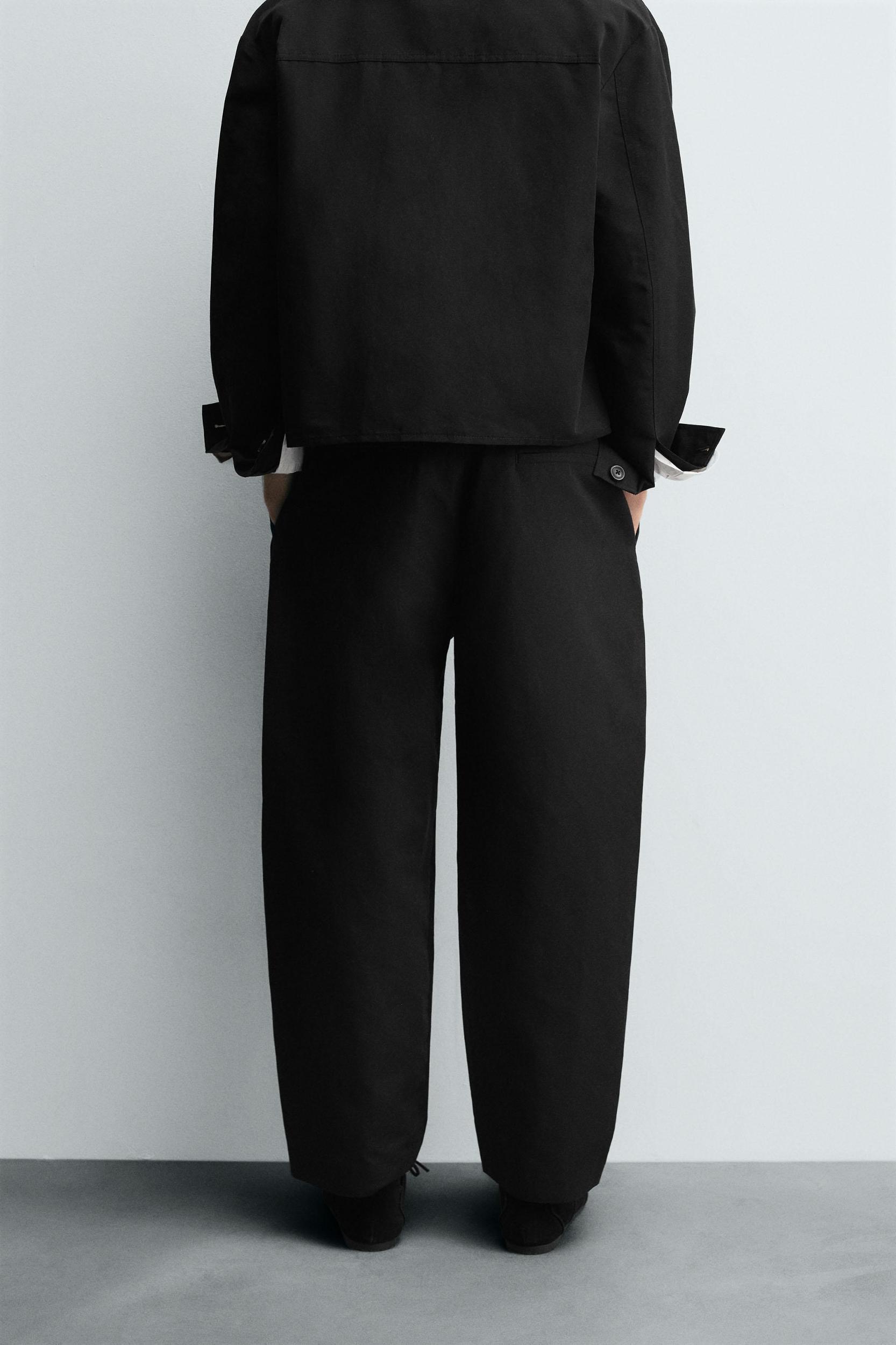 RELAXED FIT PLEATED PANTS Product Image