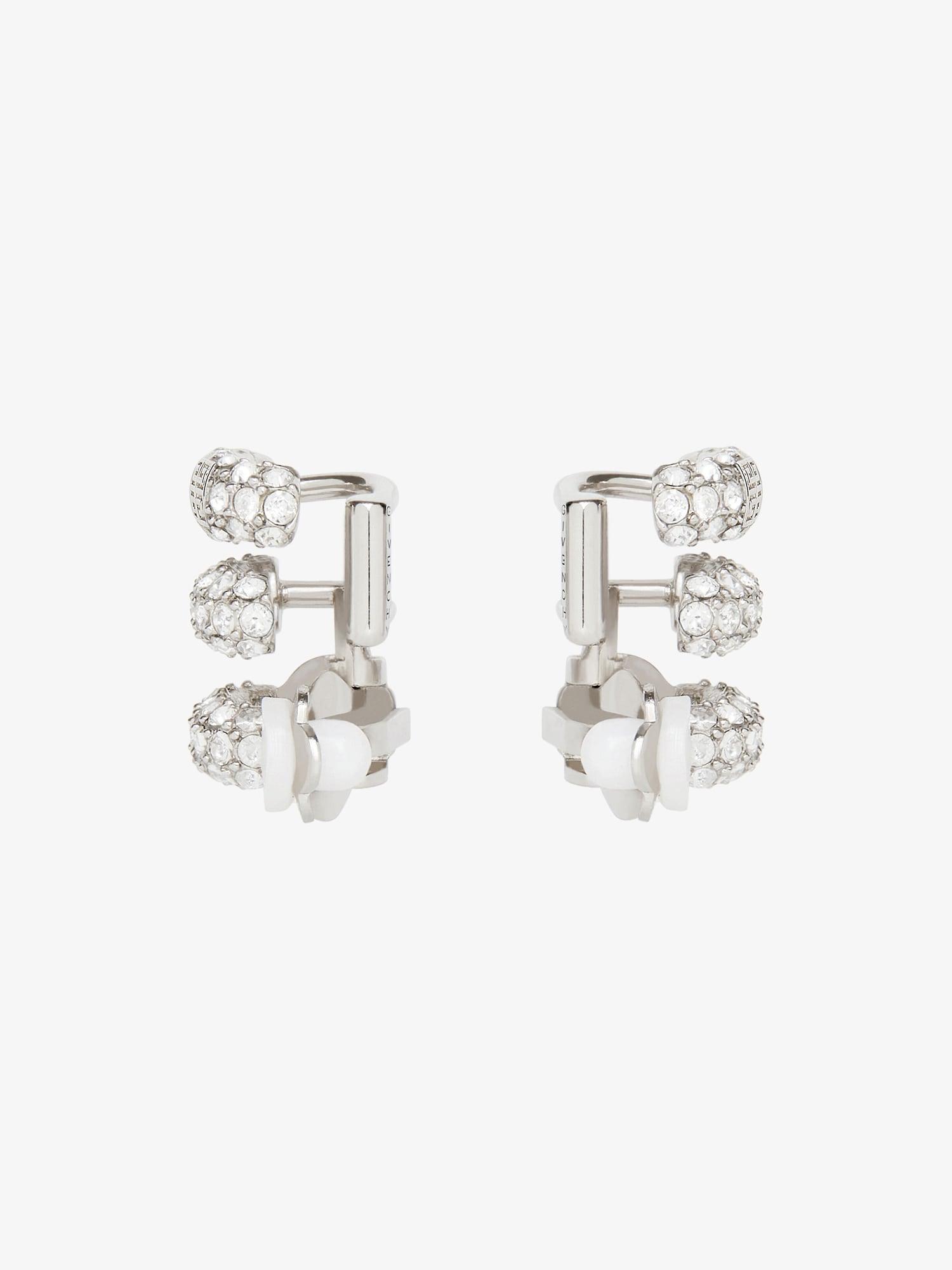 Stitch clip earrings in metal with crystals Product Image