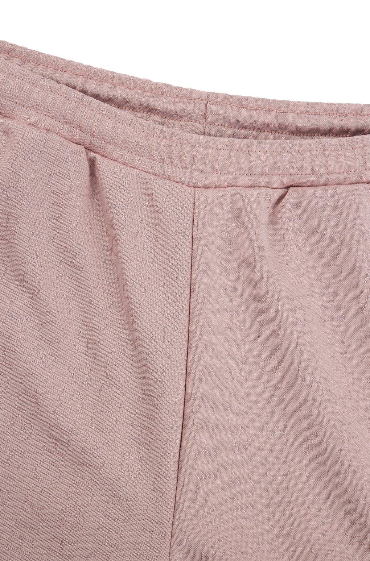 HUGO - Oversize-fit tracksuit bottoms with logo jacquard - Patterned Product Image
