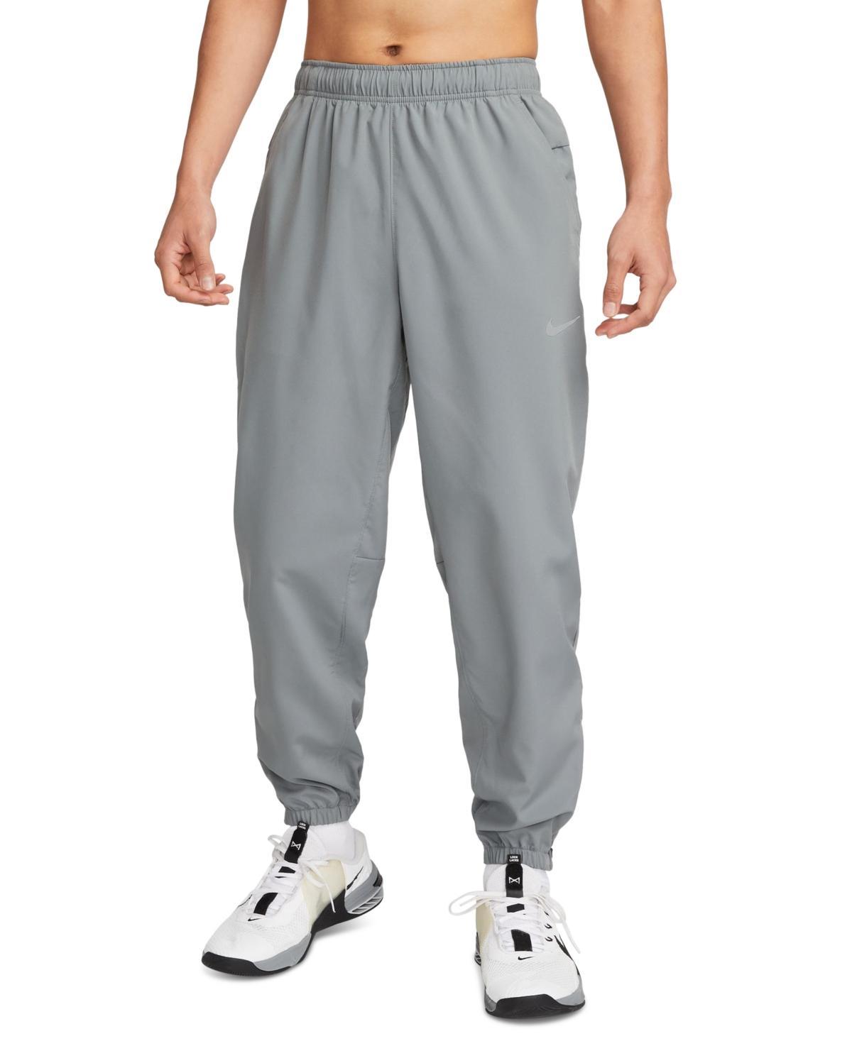 Nike Men's Form Dri-FIT Tapered Versatile Pants in Grey/Smoke Grey Size Large 100% Polyester Product Image