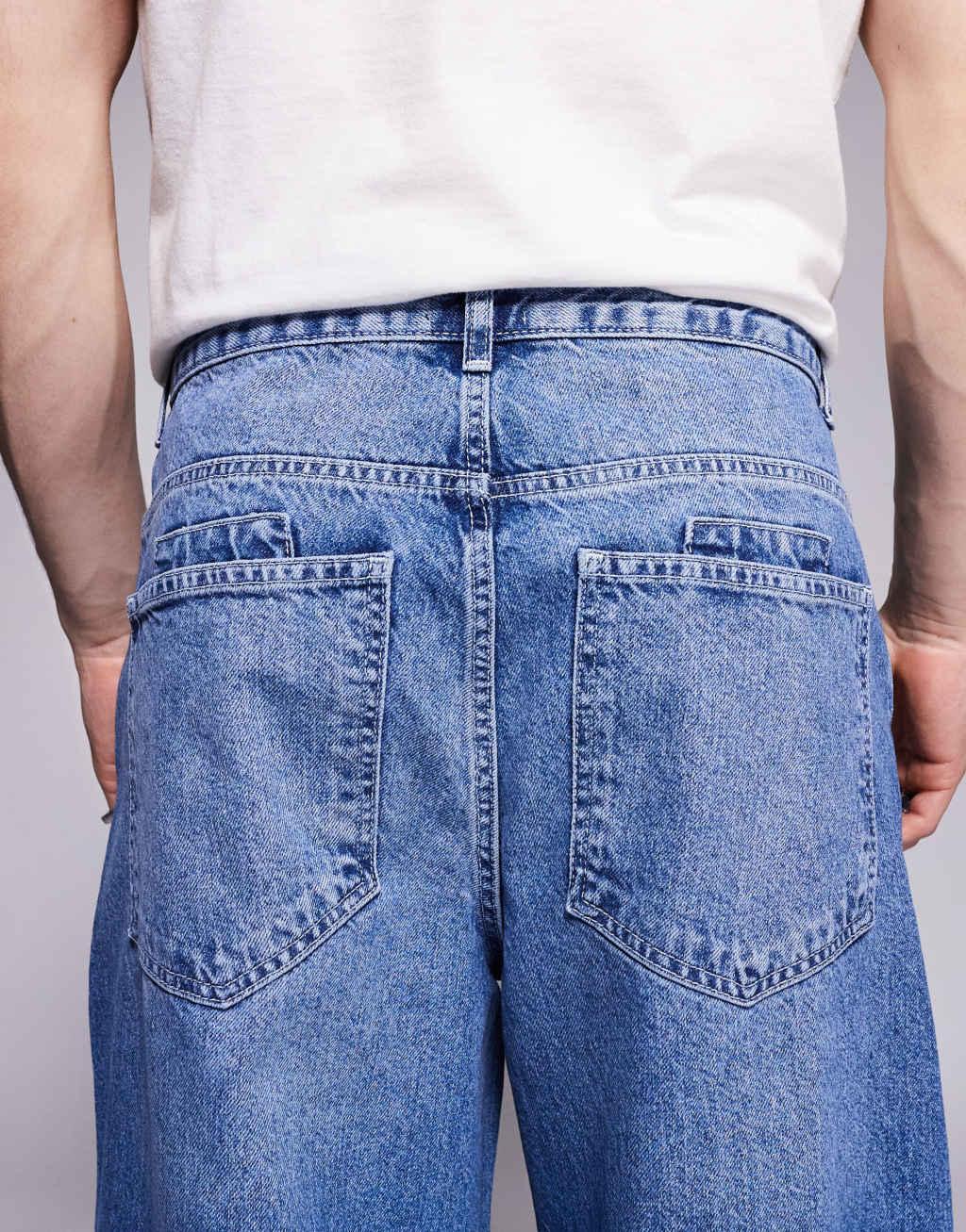 ASOS DESIGN super baggy jeans with back print in mid wash blue Product Image
