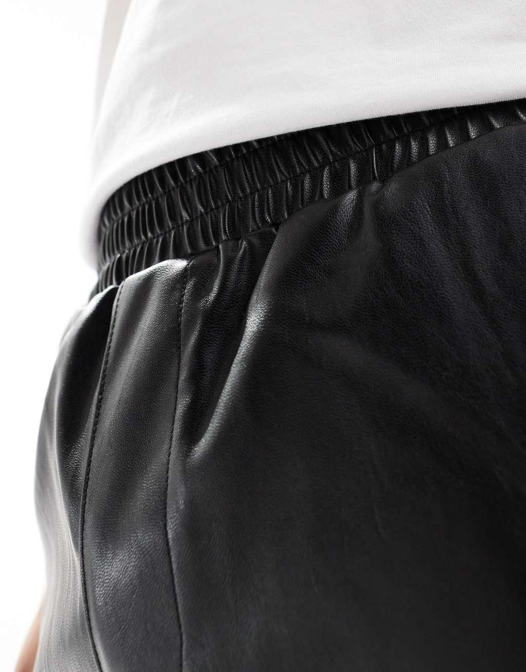 ASOS DESIGN leather look jorts in longer length in black Product Image