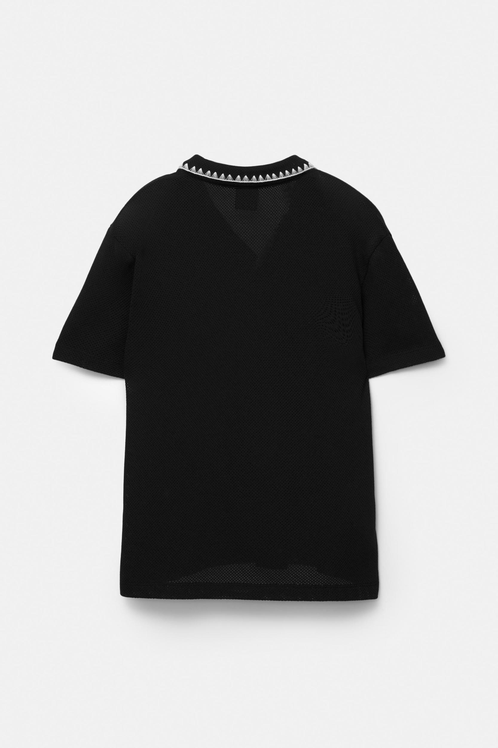 Textured polo shirt with contrast seams Product Image