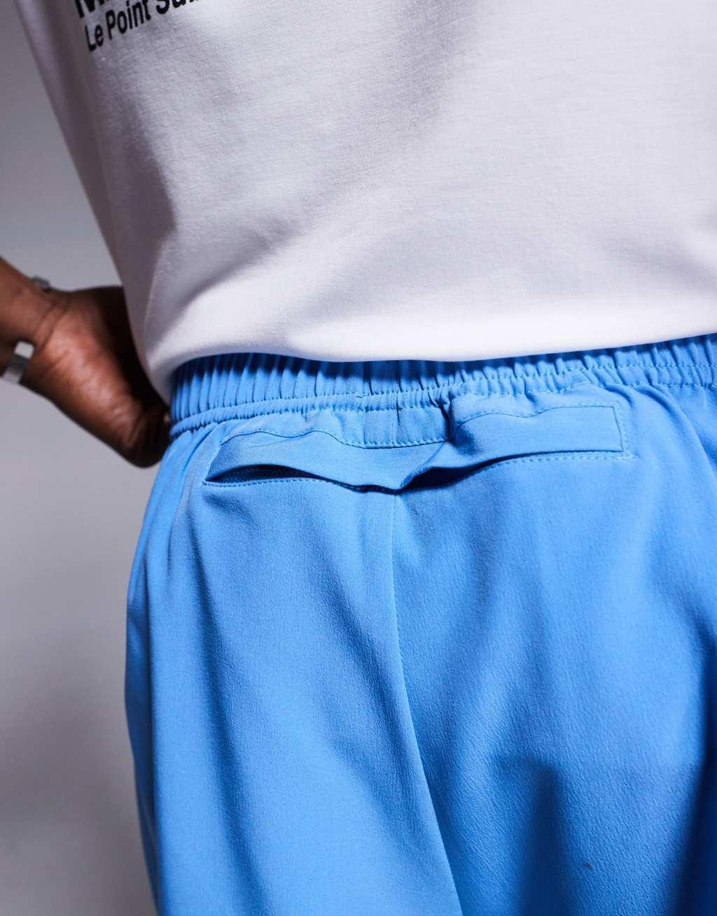 4505 Icon 3 inch quick dry running shorts with back phone pocket in blue Product Image