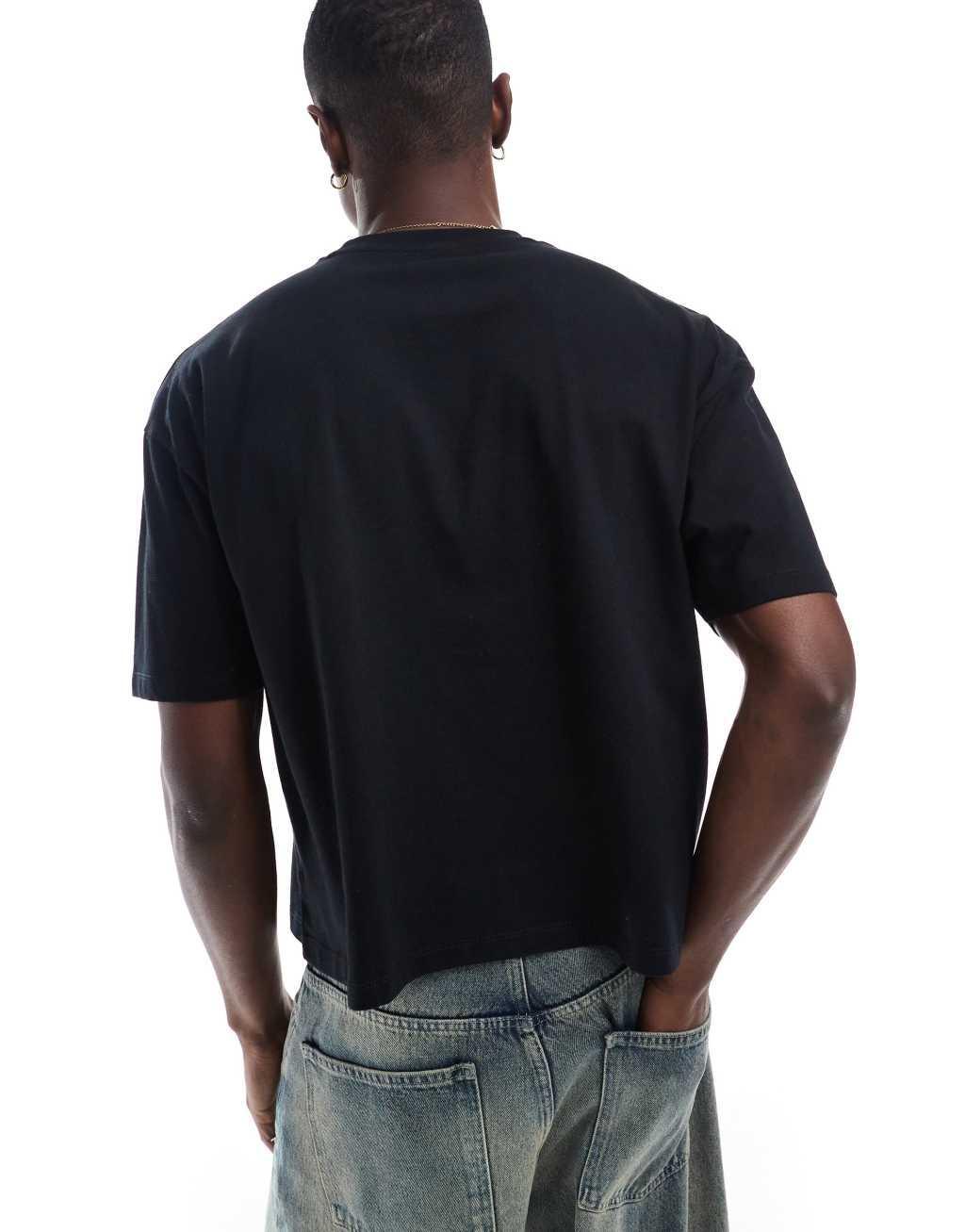 ASOS DESIGN boxy oversized t-shirt with golf front print in black Product Image