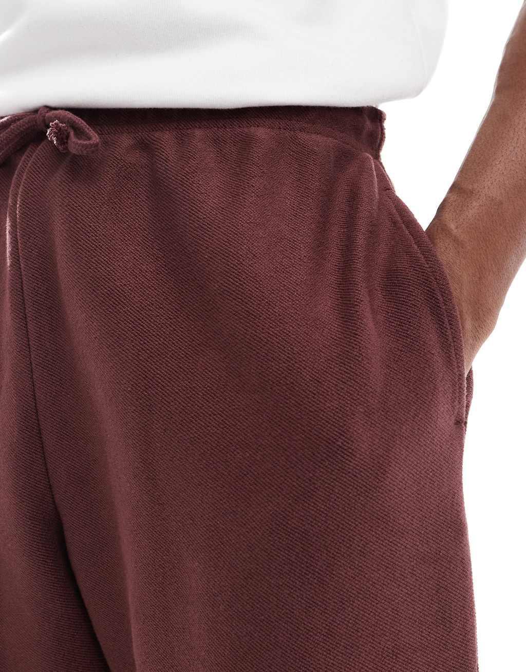 ASOS DESIGN oversized textured sweatpants in burgundy - part of a set Product Image
