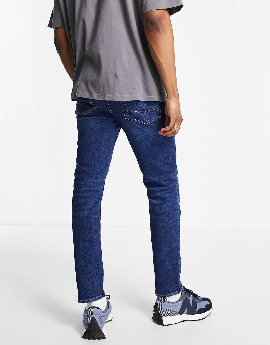 ASOS DESIGN stretch slim jeans in dark wash blue Product Image