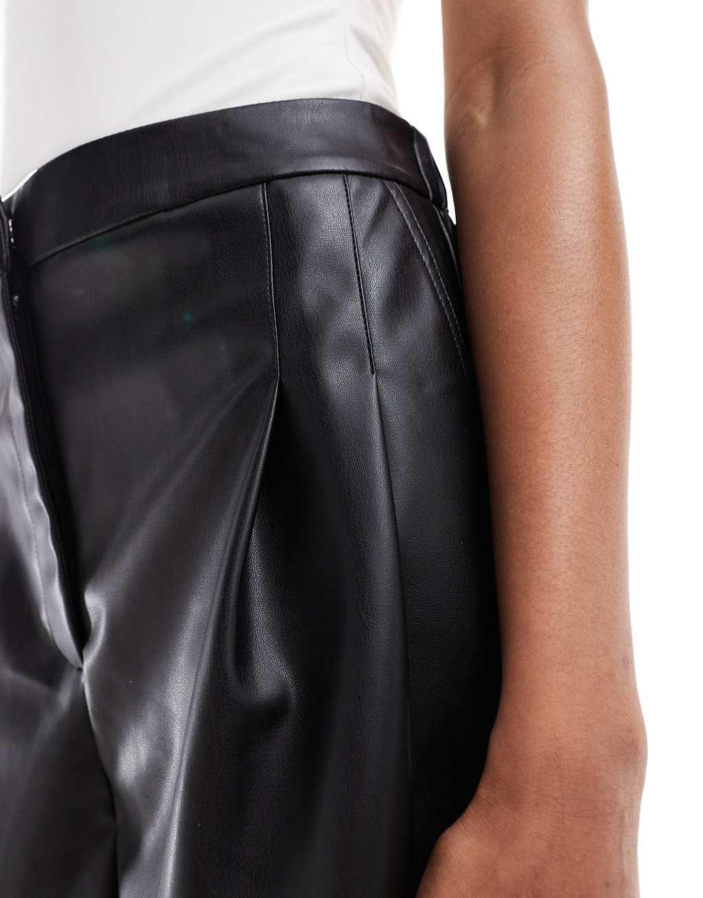 ASOS DESIGN Tall pleat detail faux leather shorts in black Product Image