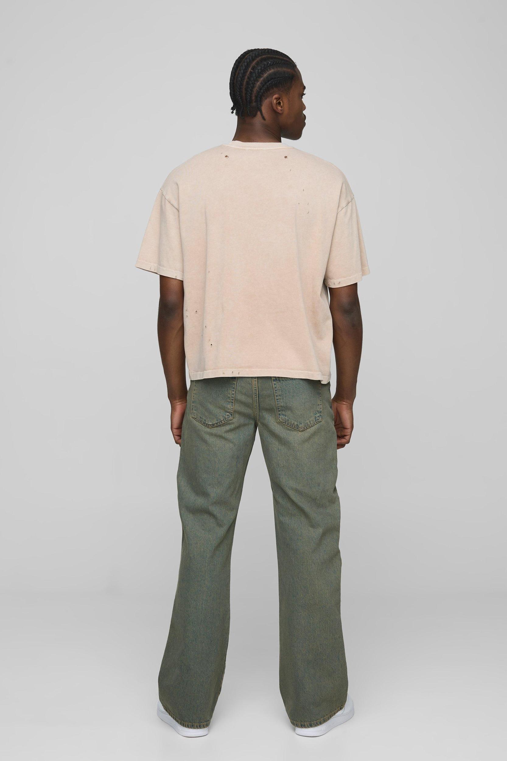Relaxed Flared Ripped Knee Antique Wash Jeans | boohooMAN USA Product Image