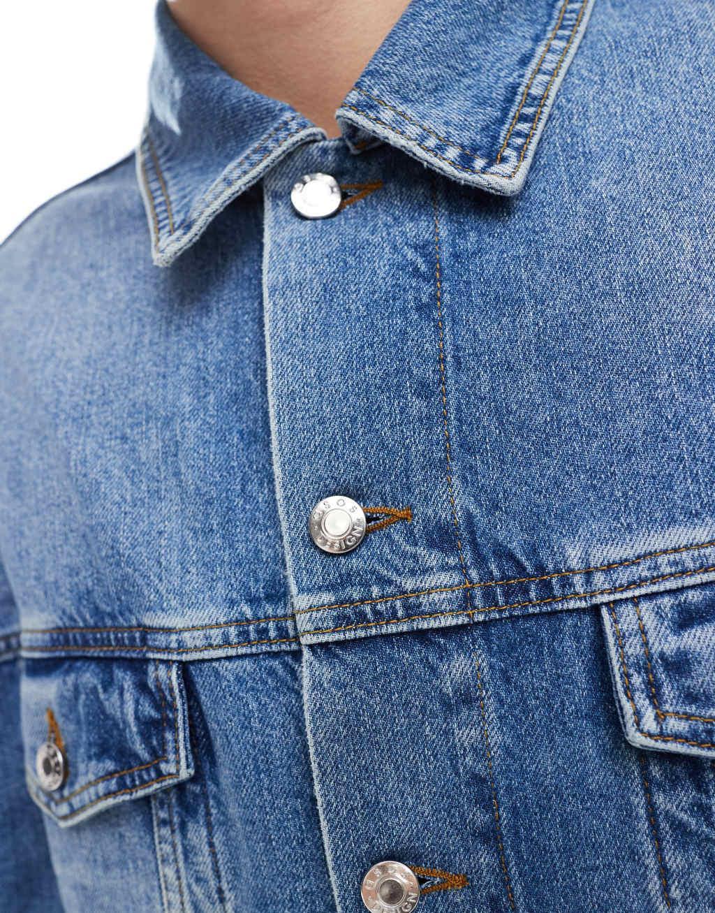 ASOS DESIGN oversized trucker jacket in mid wash blue Product Image