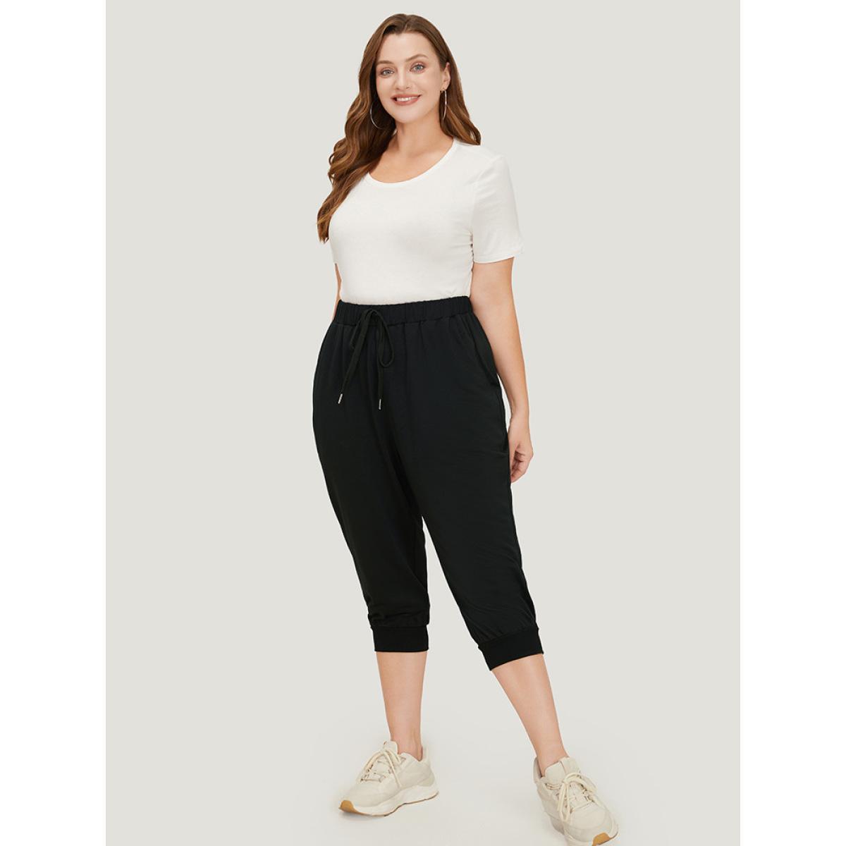 Plus Size Solid Knot Front Pocket Carrot Pants Women Black Casual High Rise Dailywear Pants BloomChic 10/M Product Image