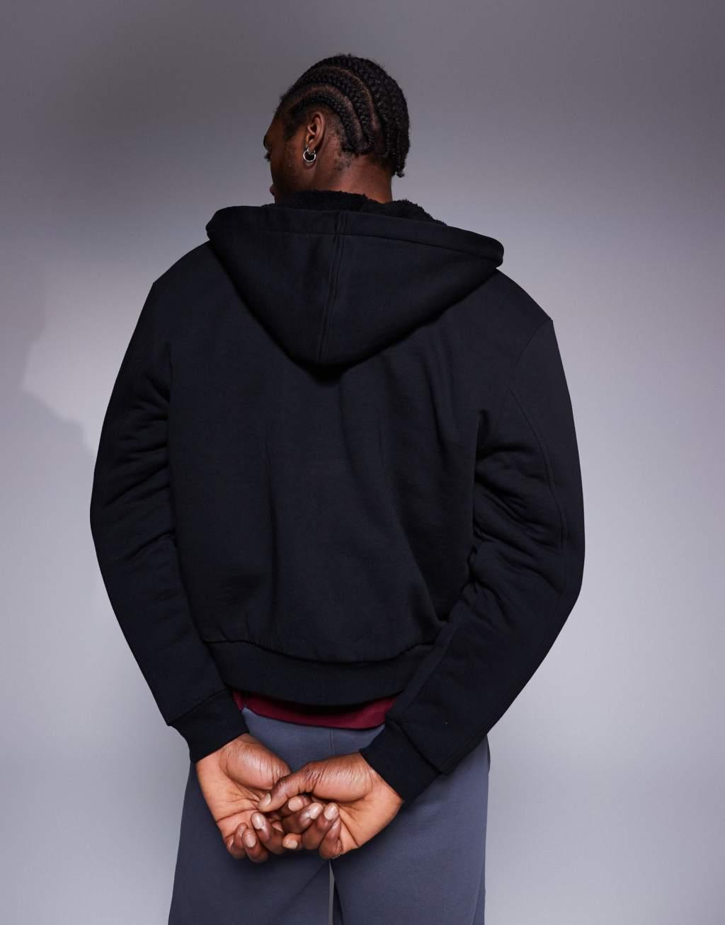 ASOS DESIGN oversized boxy zip through hoodie with borg lining in black Product Image