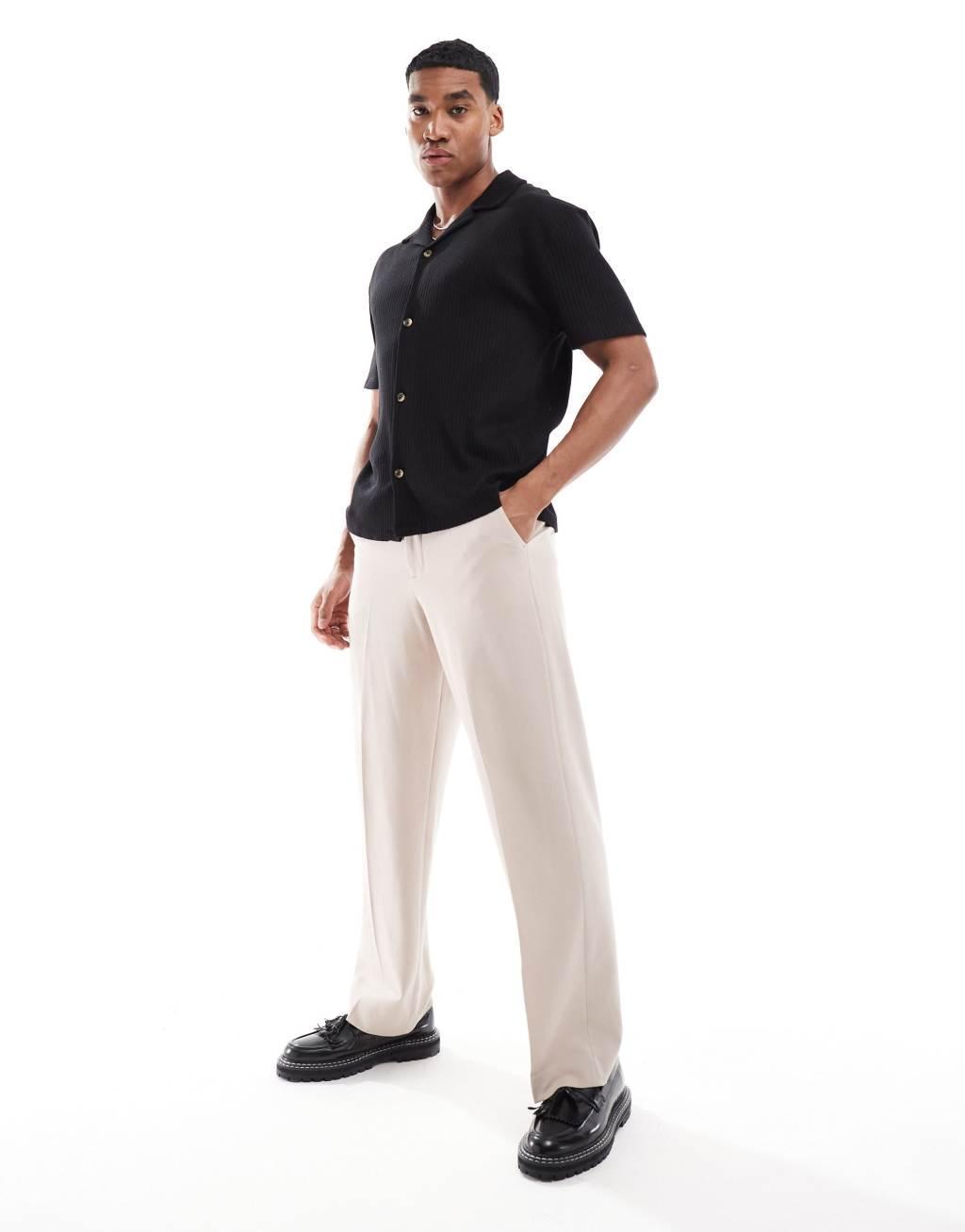ASOS DESIGN relaxed ribbed polo shirt in black Product Image