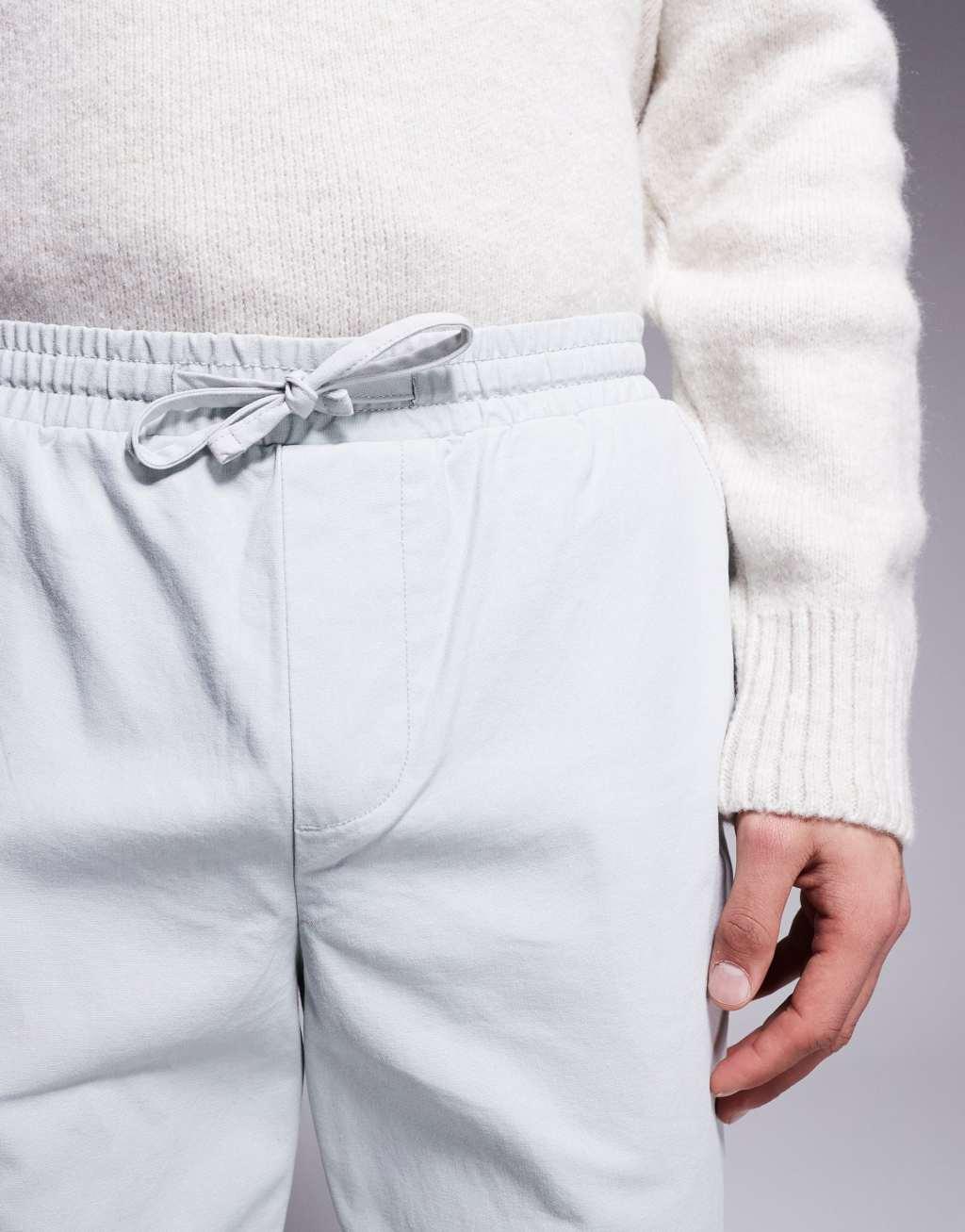ASOS DESIGN tapered pull on pants with back pocket patch in gray Product Image