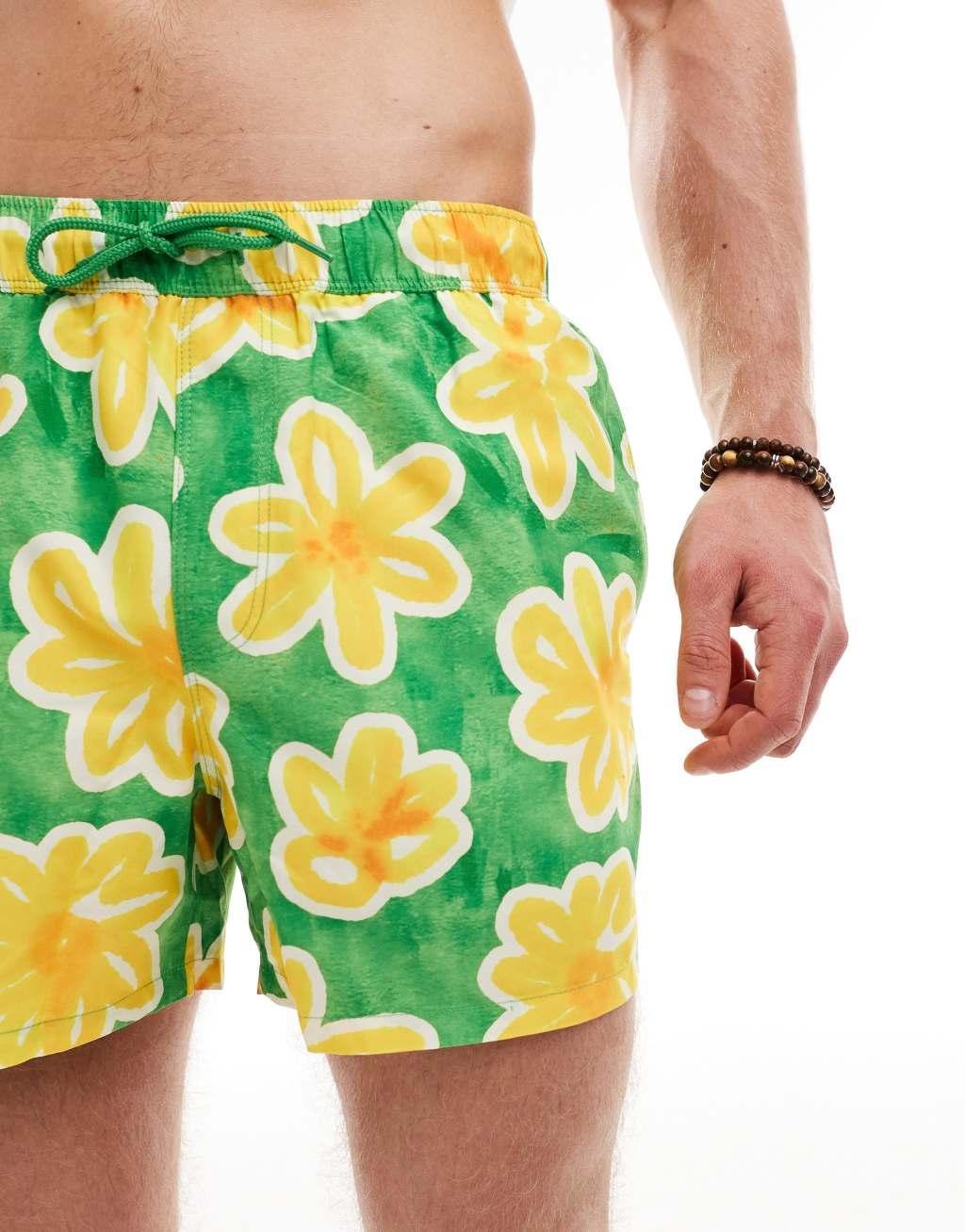 ASOS DESIGN swim shorts in short length in green floral print Product Image