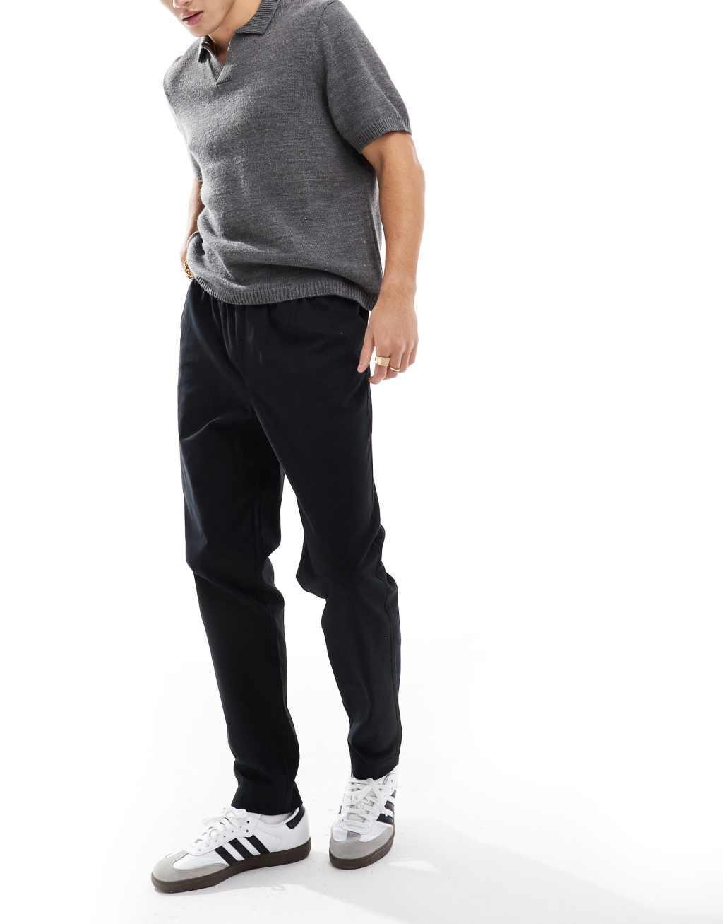 ASOS DESIGN tapered pull on pants in black with patch Product Image