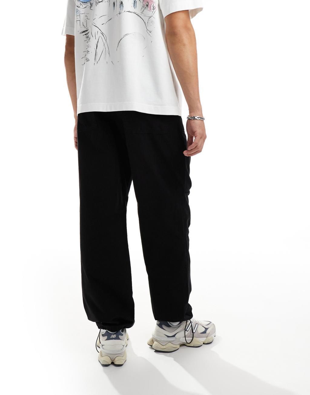 Selected Homme loose fit elastic waistband ripstop pants in black Product Image