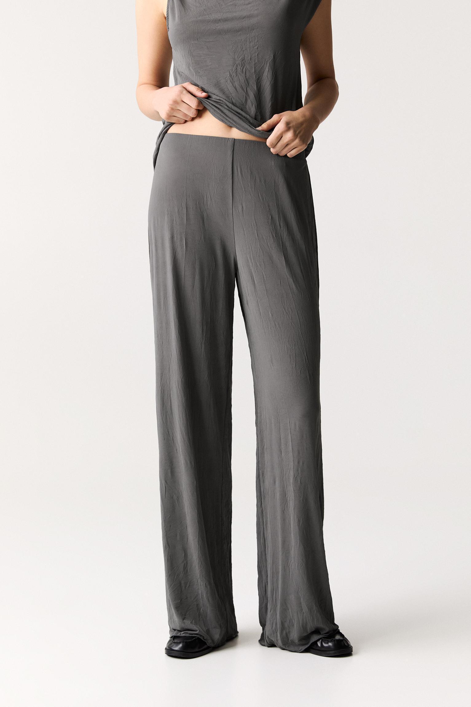 Creased-effect flared pants Product Image