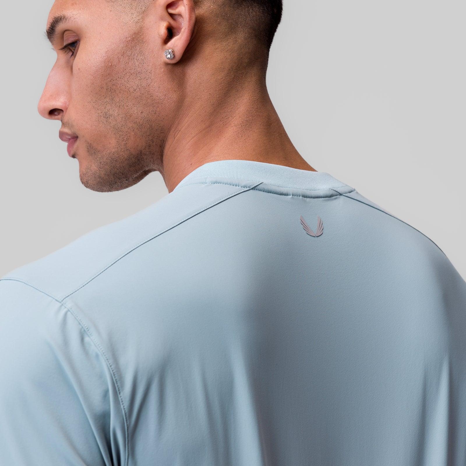 1087. Tetra-Lite® Ice Zip Tee - Light Sky Product Image