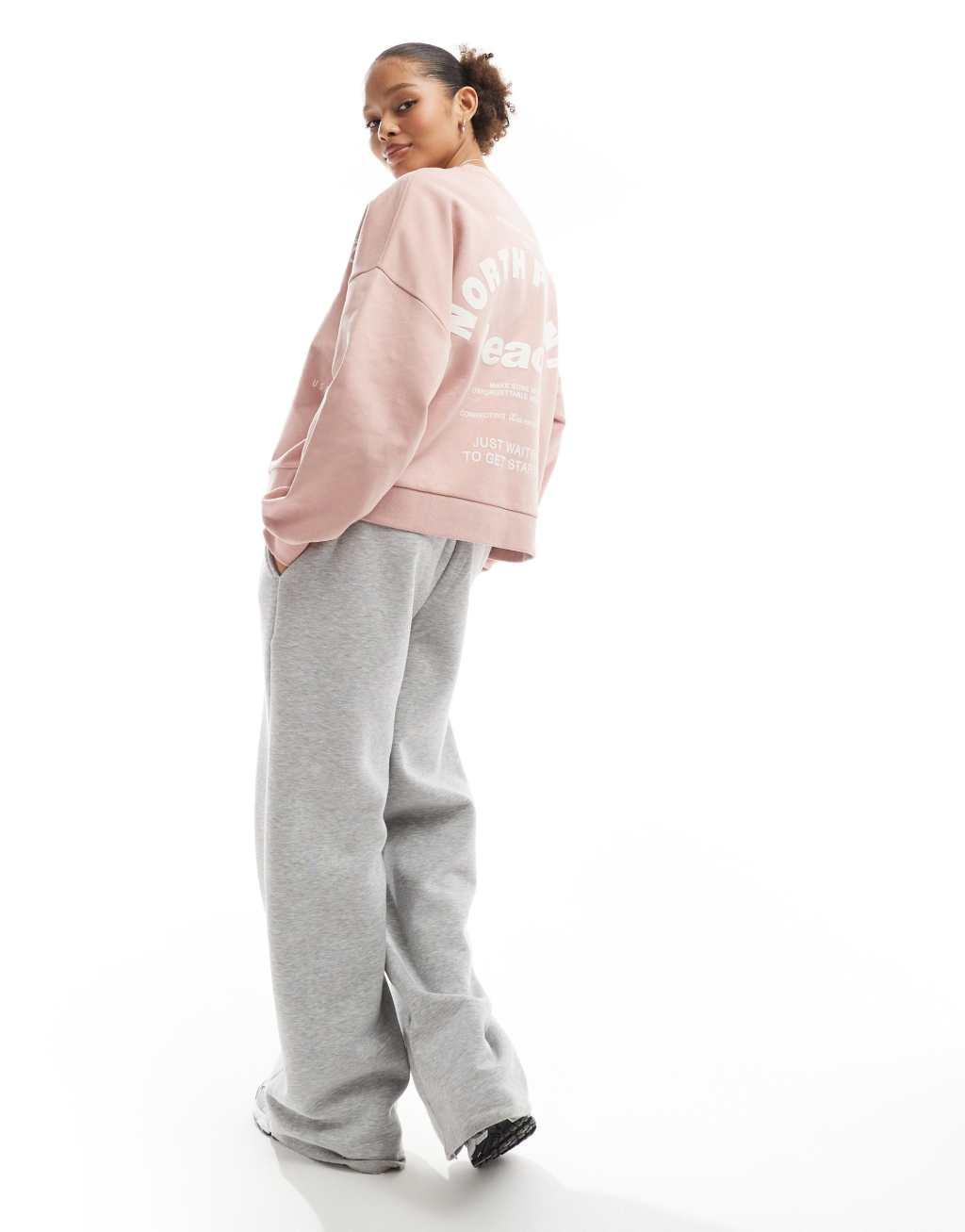 Bershka graphic sweater in dusty pink Product Image