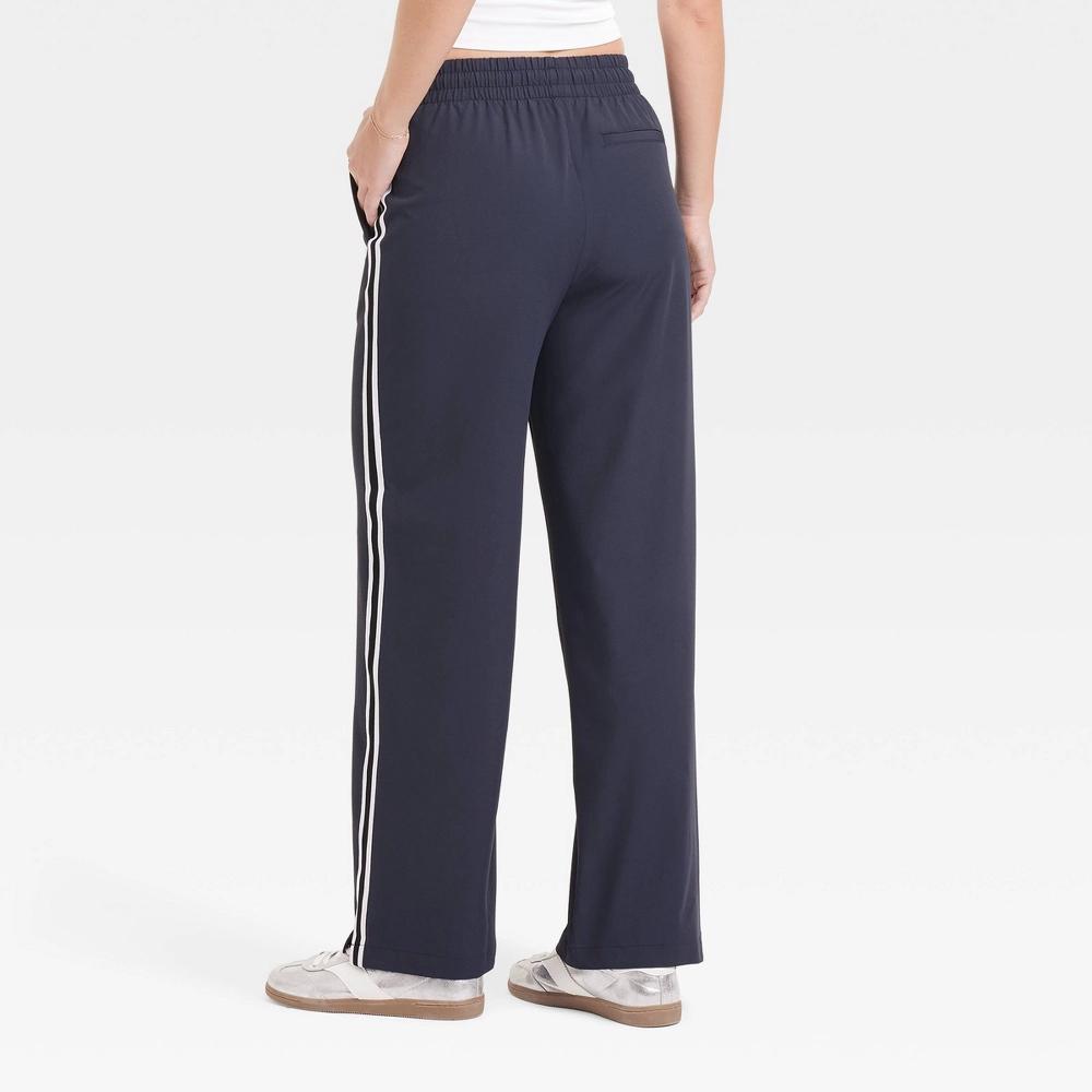 Womens Woven High-Rise Track Pants - All In Motion Dark Blue S: Recycled Polyester, Spandex, Moisture Wicking, Quick Drying Product Image