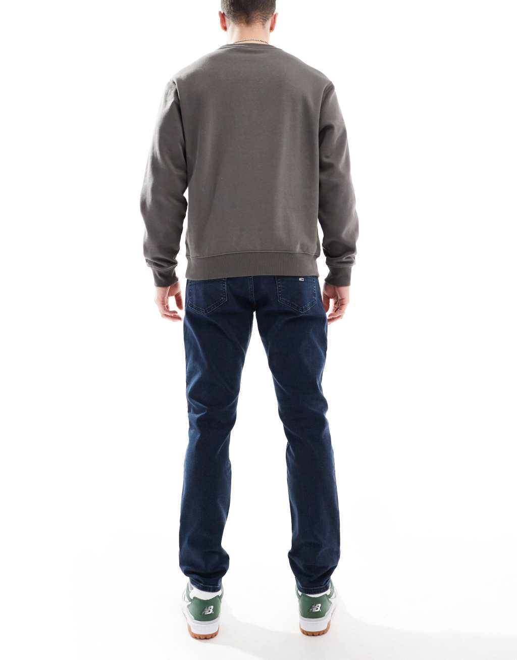 Tommy Jeans Austin slim tapered jeans in dark wash Product Image