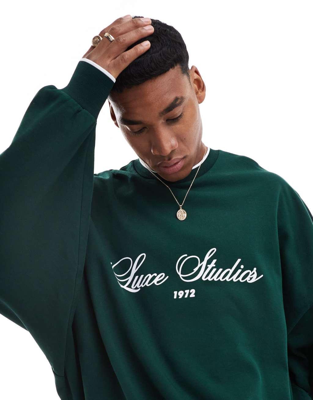 ASOS DESIGN extreme oversized crew neck sweatshirt with text print in dark green Product Image