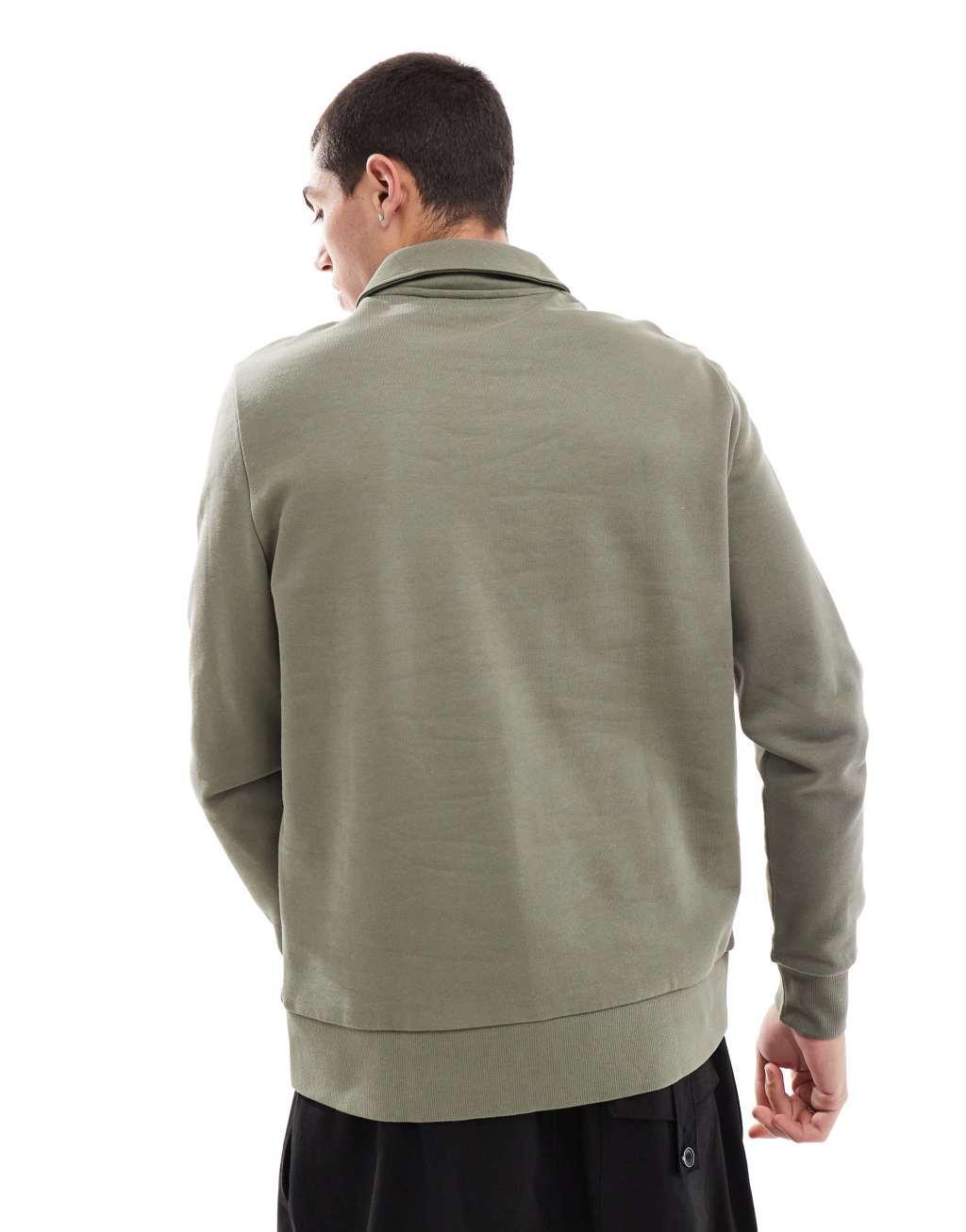 ASOS DESIGN polo sweatshirt with zipper in khaki Product Image