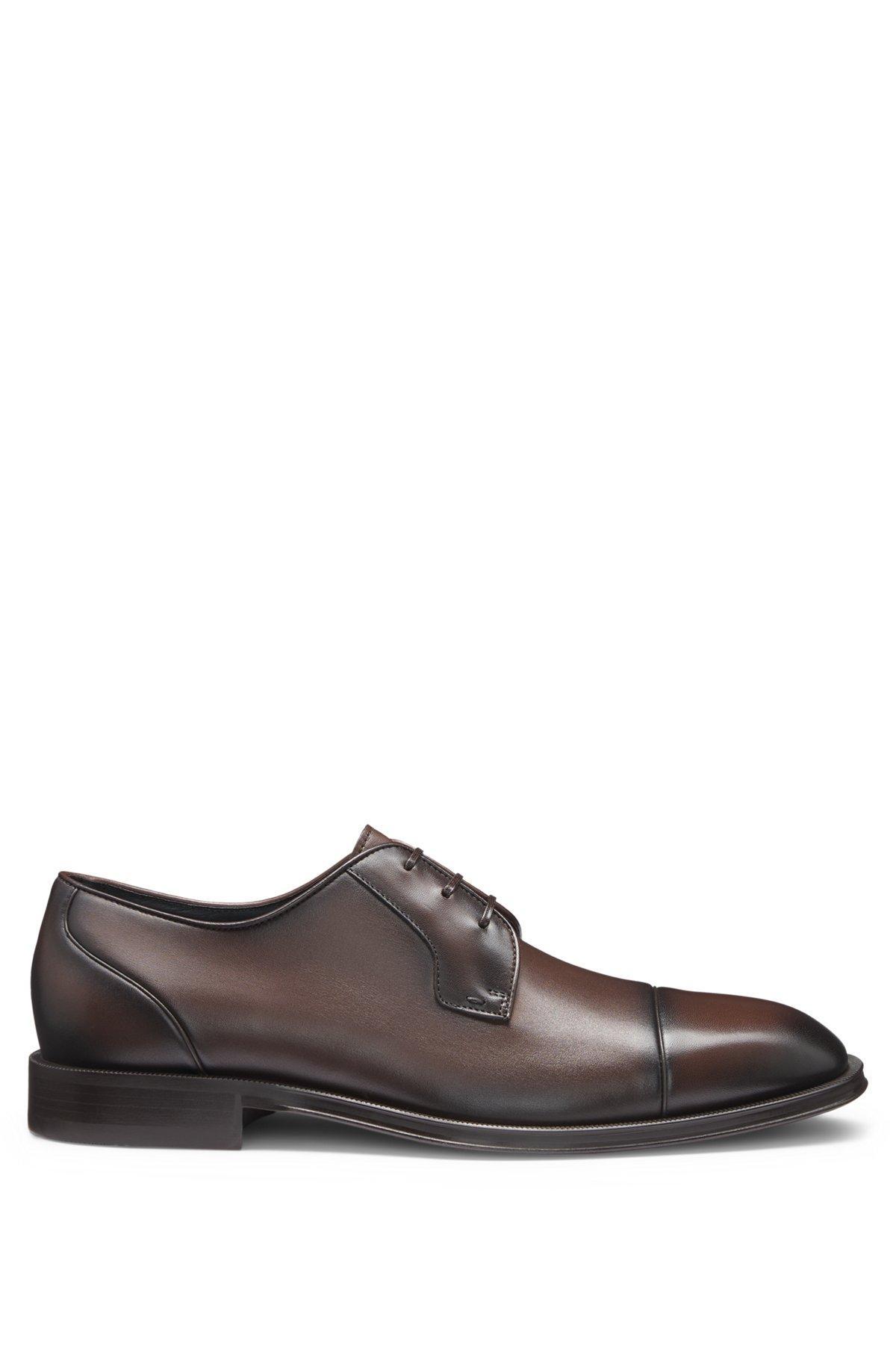 Cap-toe Derby shoes in leather Product Image