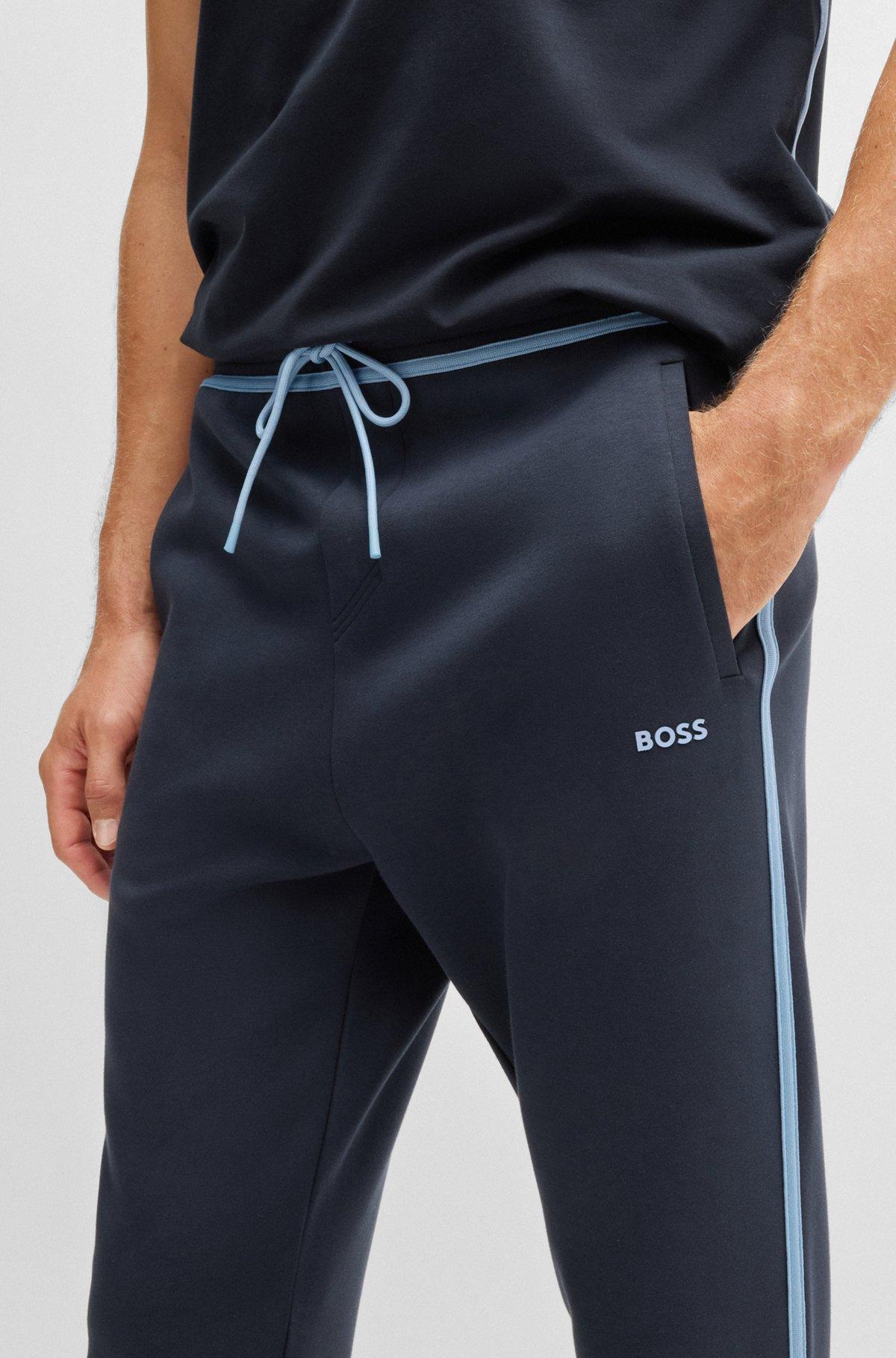 Tracksuit bottoms with tape and logo Product Image