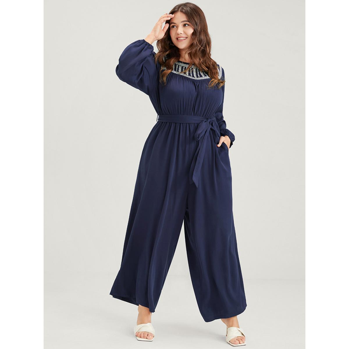 Plus Size DarkBlue Solid Pocket Lantern Sleeve Embroidered Belted Jumpsuit Women Elegant Long Sleeve Round Neck Dailywear Loose Jumpsuits BloomChic 12/L Product Image