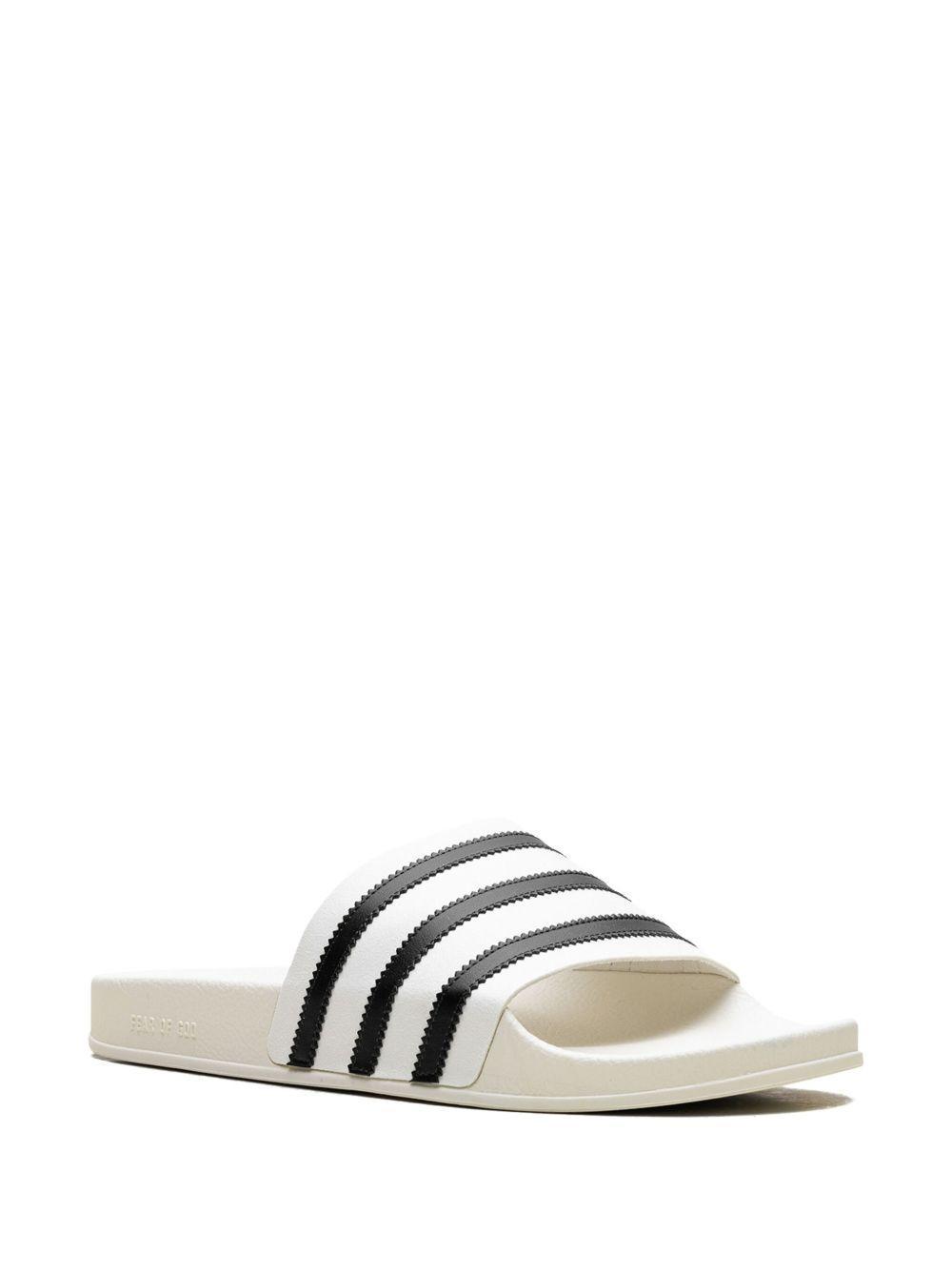 x Fear of God Athletics Adilette "Cream White" slides Product Image