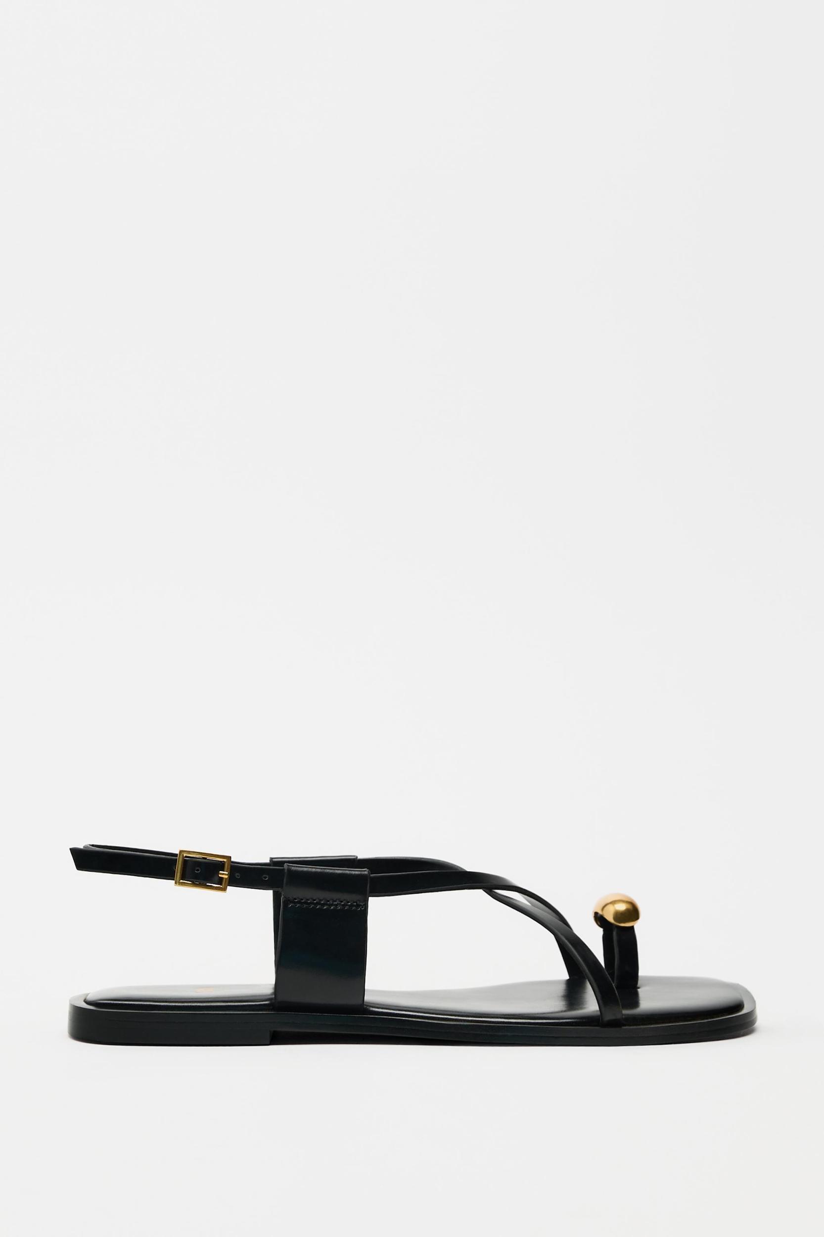 FLAT STRAPPY SANDALS WITH METAL ORNAMENT Product Image