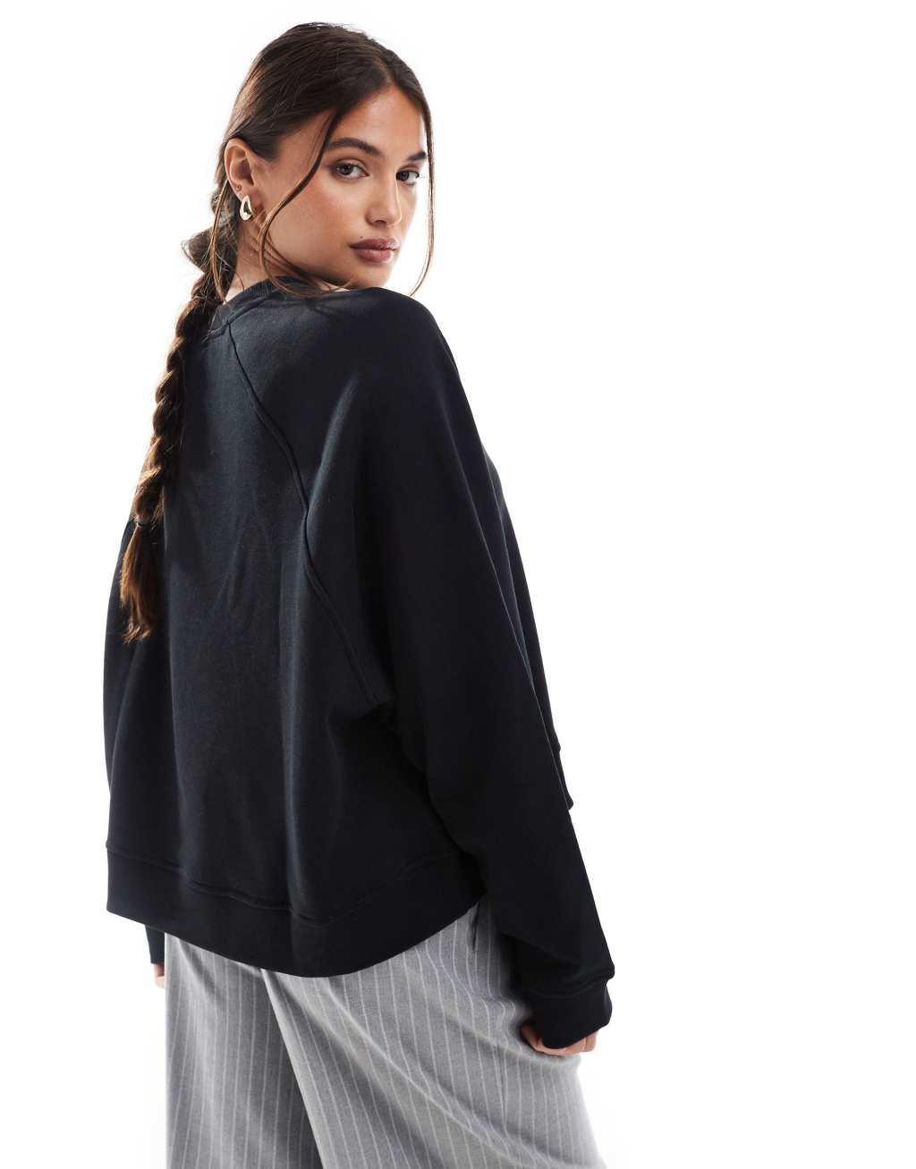 ASOS DESIGN oversized sweat with raglan detail in black Product Image