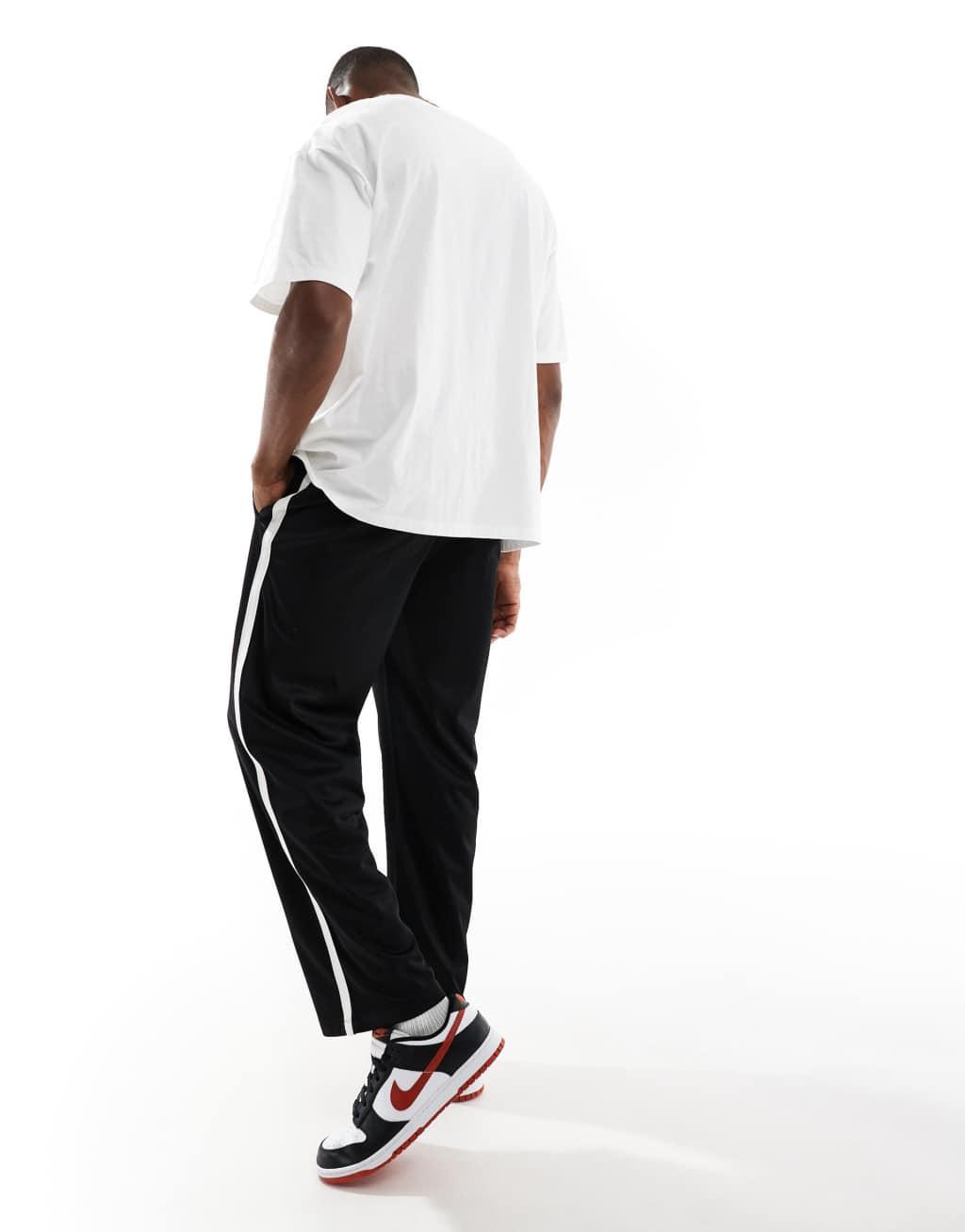 Bershka wide fit side panel sweatpants in black Product Image