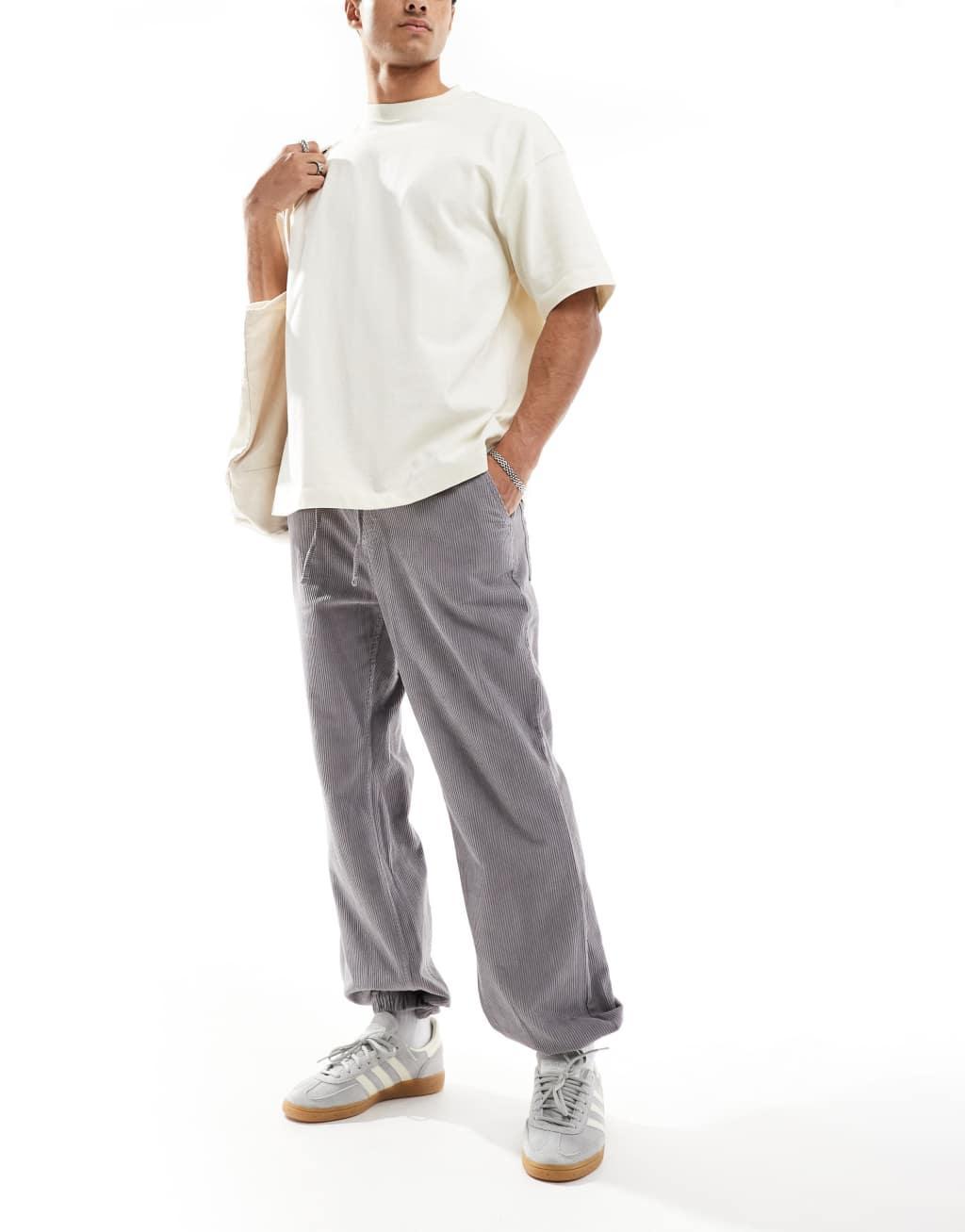 ASOS DESIGN tapered washed cord sweatpants in gray Product Image