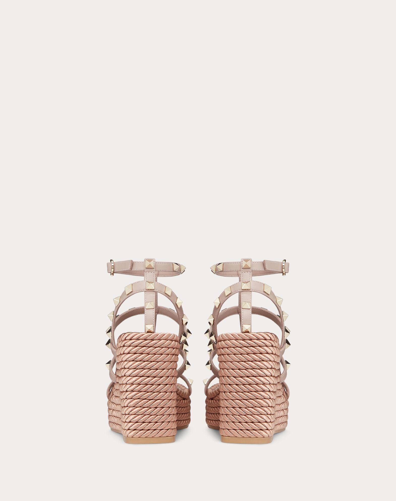 ROCKSTUD ANKLE STRAP WEDGE SANDAL IN CALFSKIN LEATHER 95 MM Product Image