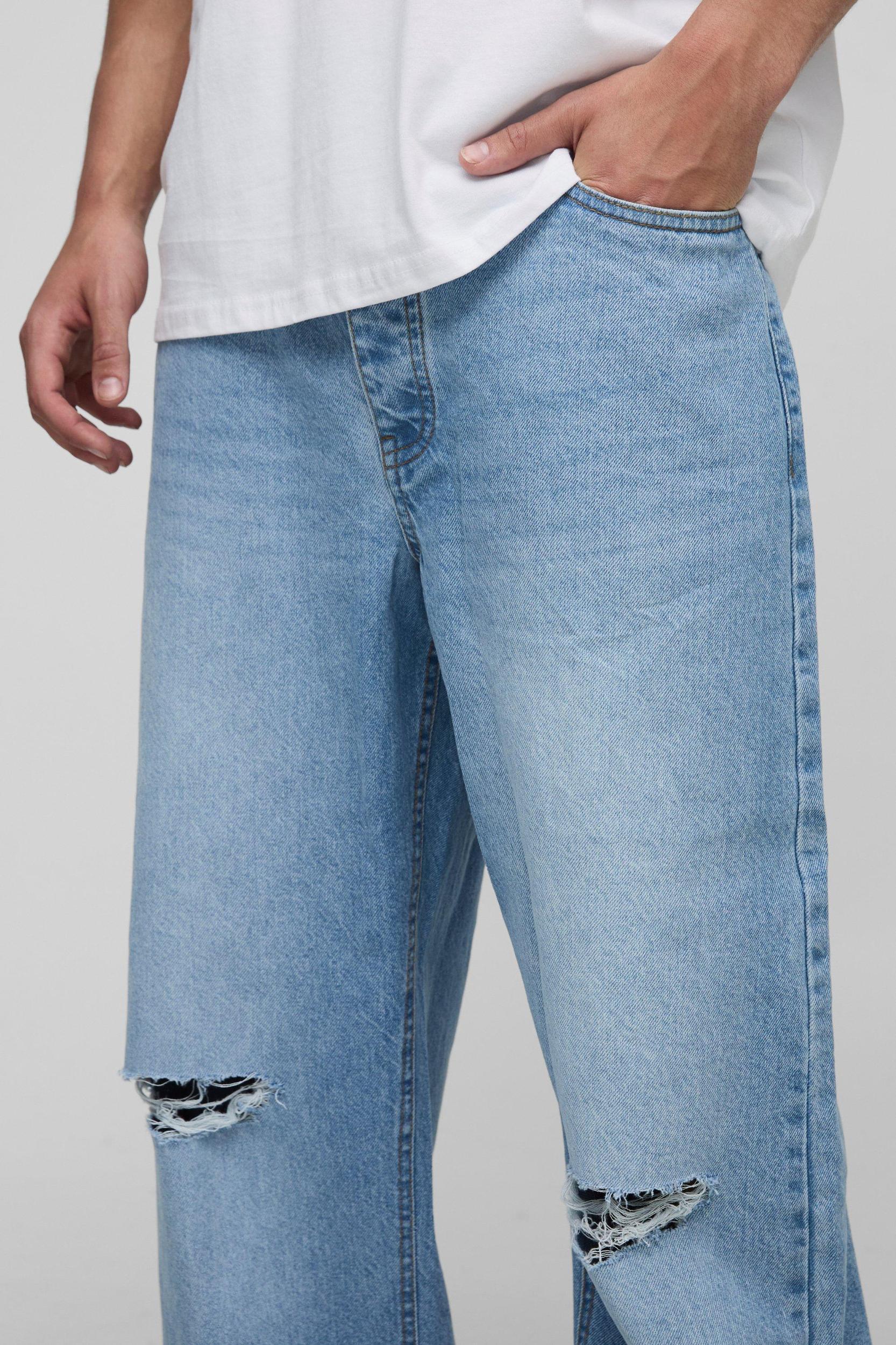 Wide Leg Ripped Knee Jeans With Let Down Hem | boohooMAN USA Product Image