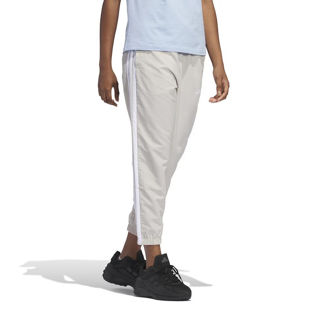 Women's adidas Essentials 3-Stripes Woven 7/8 Sportswear Pants, Size: Large, Wonder Alumina Product Image