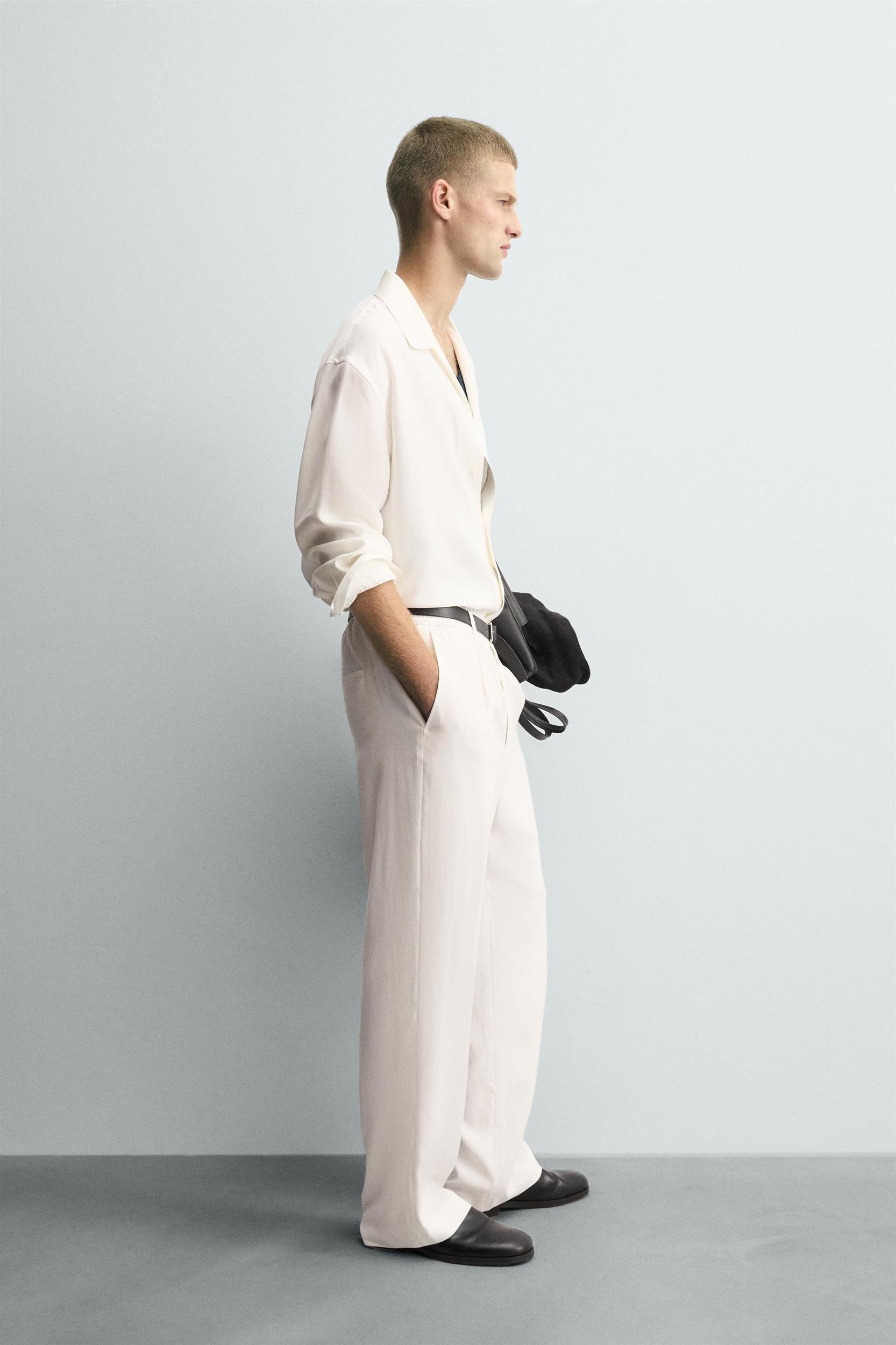 RELAXED FIT PLEATED PANTS Product Image