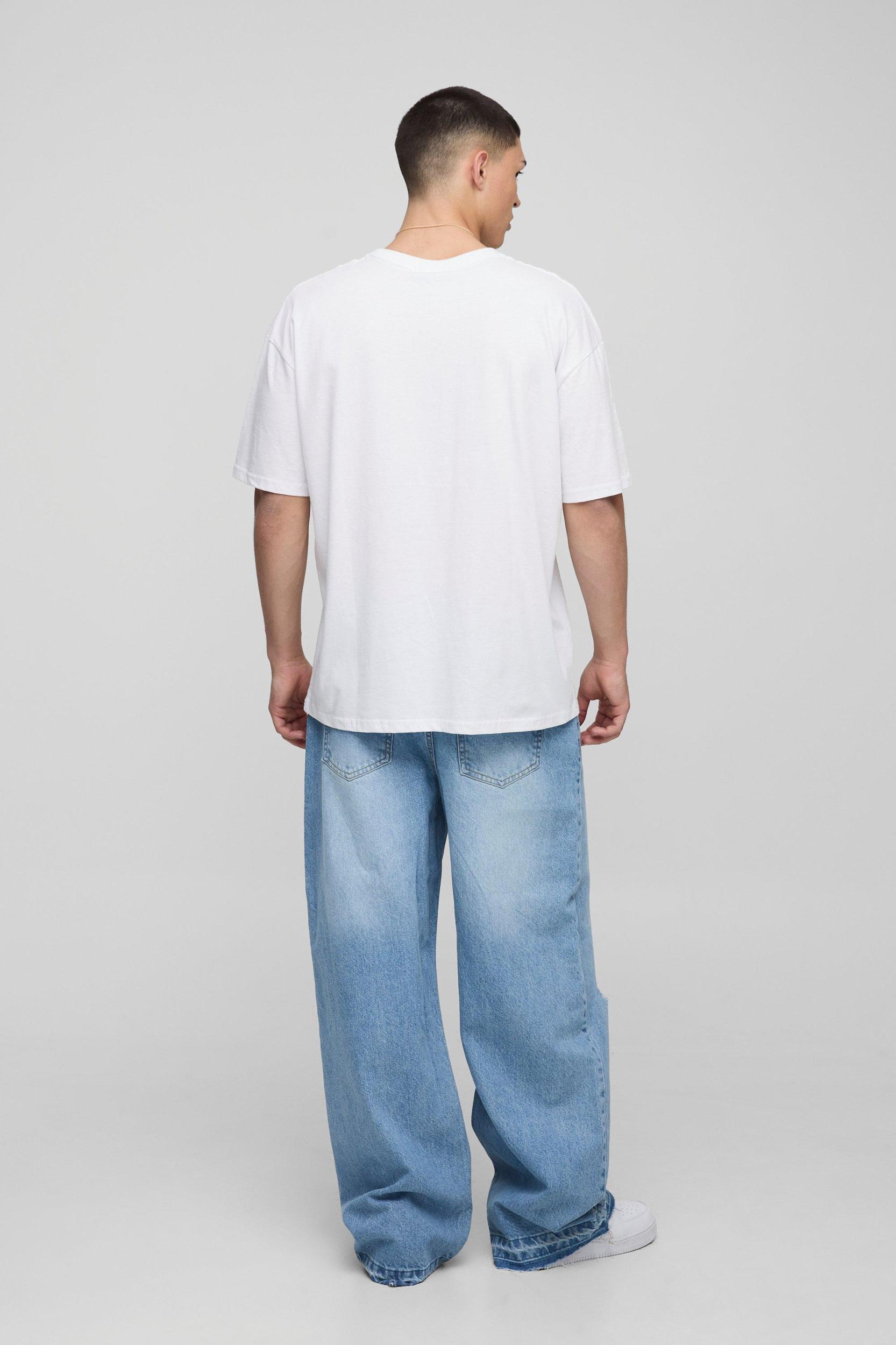 Wide Leg Ripped Knee Jeans With Let Down Hem | boohooMAN USA Product Image