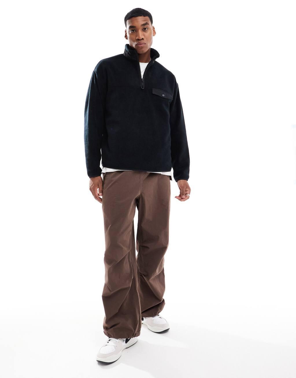 ASOS DESIGN oversized half zip fleece sweatshirt with chest pocket in black Product Image