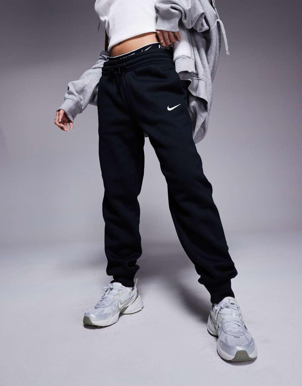 Nike Phoenix Fleece cuffed sweatpants in black Product Image