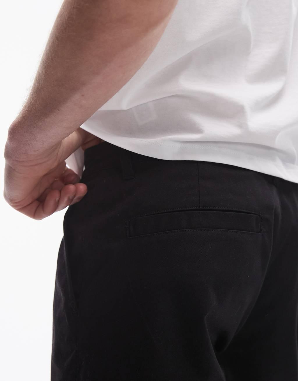 Topman twin pleated tapered pants in black Product Image