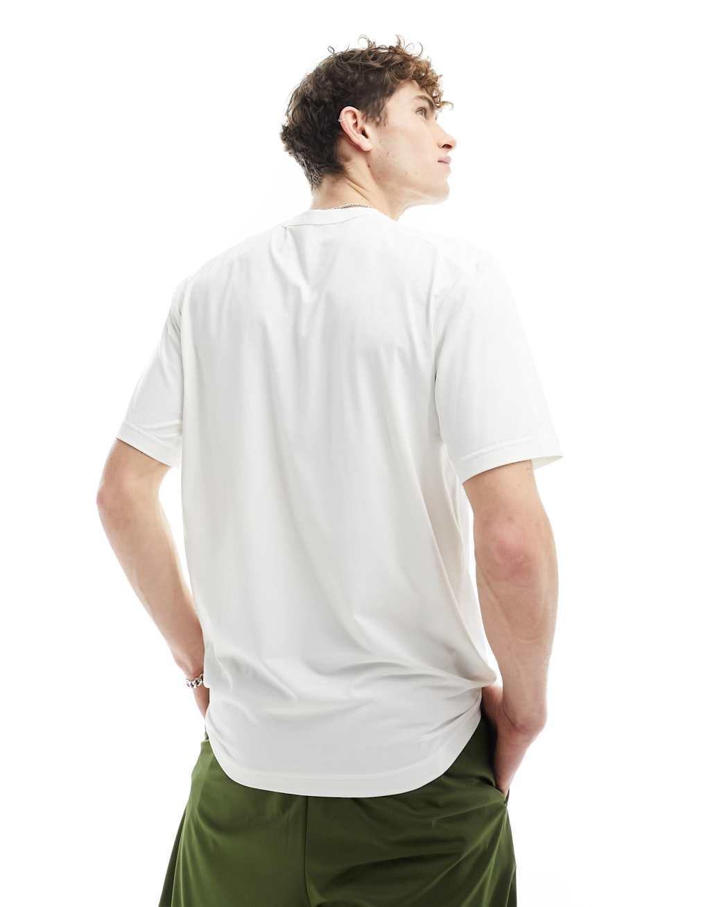 Nike Training Dri-FIT bodega graphic t-shirt in white and orange Product Image